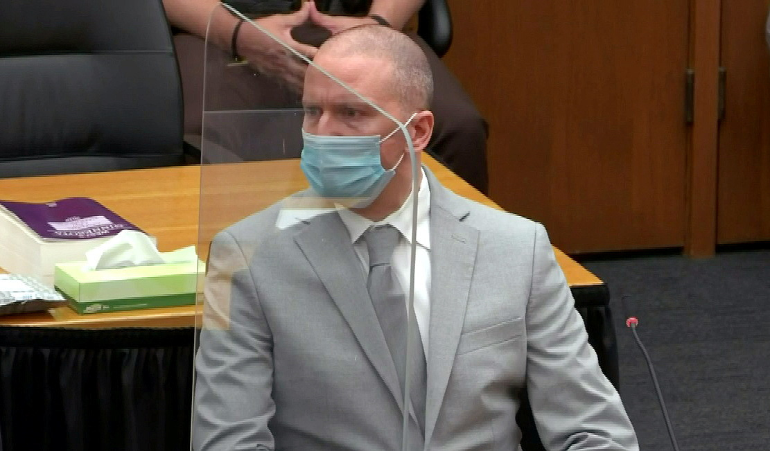 Former Minneapolis police officer Derek Chauvin listens to his mother Carolyn Pawlenty deliver a statement to the judge as he awaits his sentencing for murder in the death of George Floyd during a sentencing hearing in Minneapolis, Minnesota, U.S. June 25, 2021 in a still image from video. 