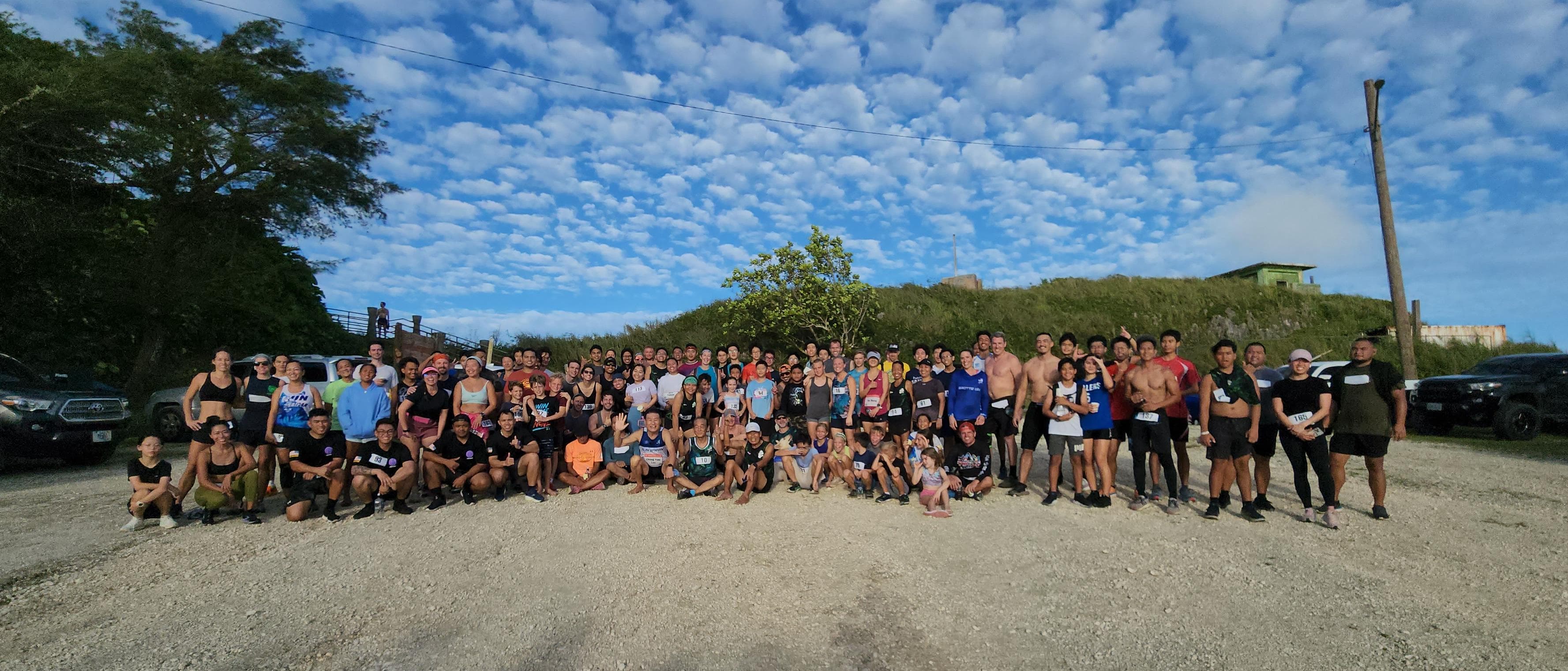 The participants pose  for a photo after completing the 2023 NMA Mt. Tapochao Turkey Trot on Thursday.Photos by James F. Sablan Jr.