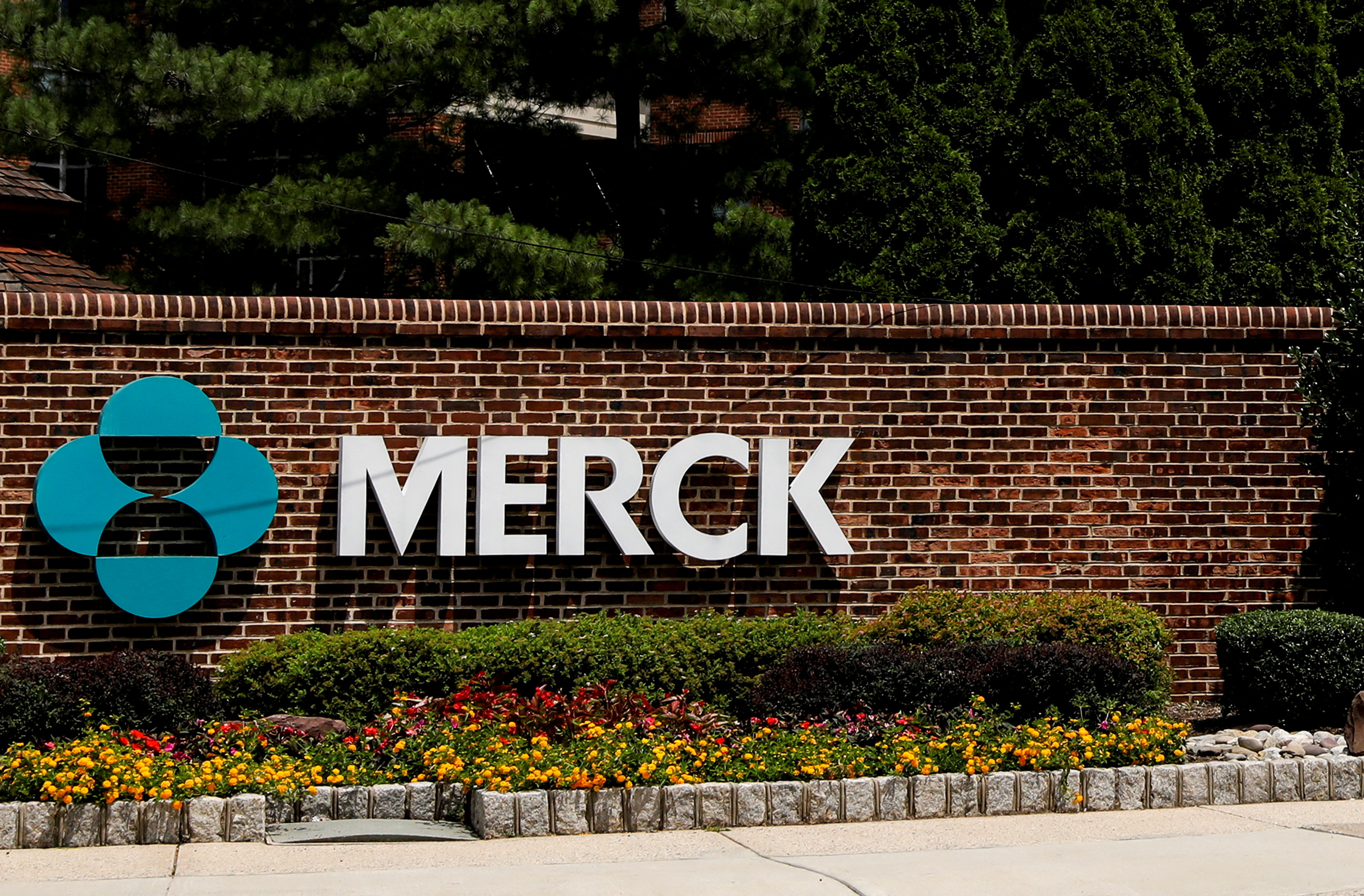 The Merck logo is seen at a gate to the Merck & Co campus in Rahway, New Jersey, U.S., July 12, 2018. 