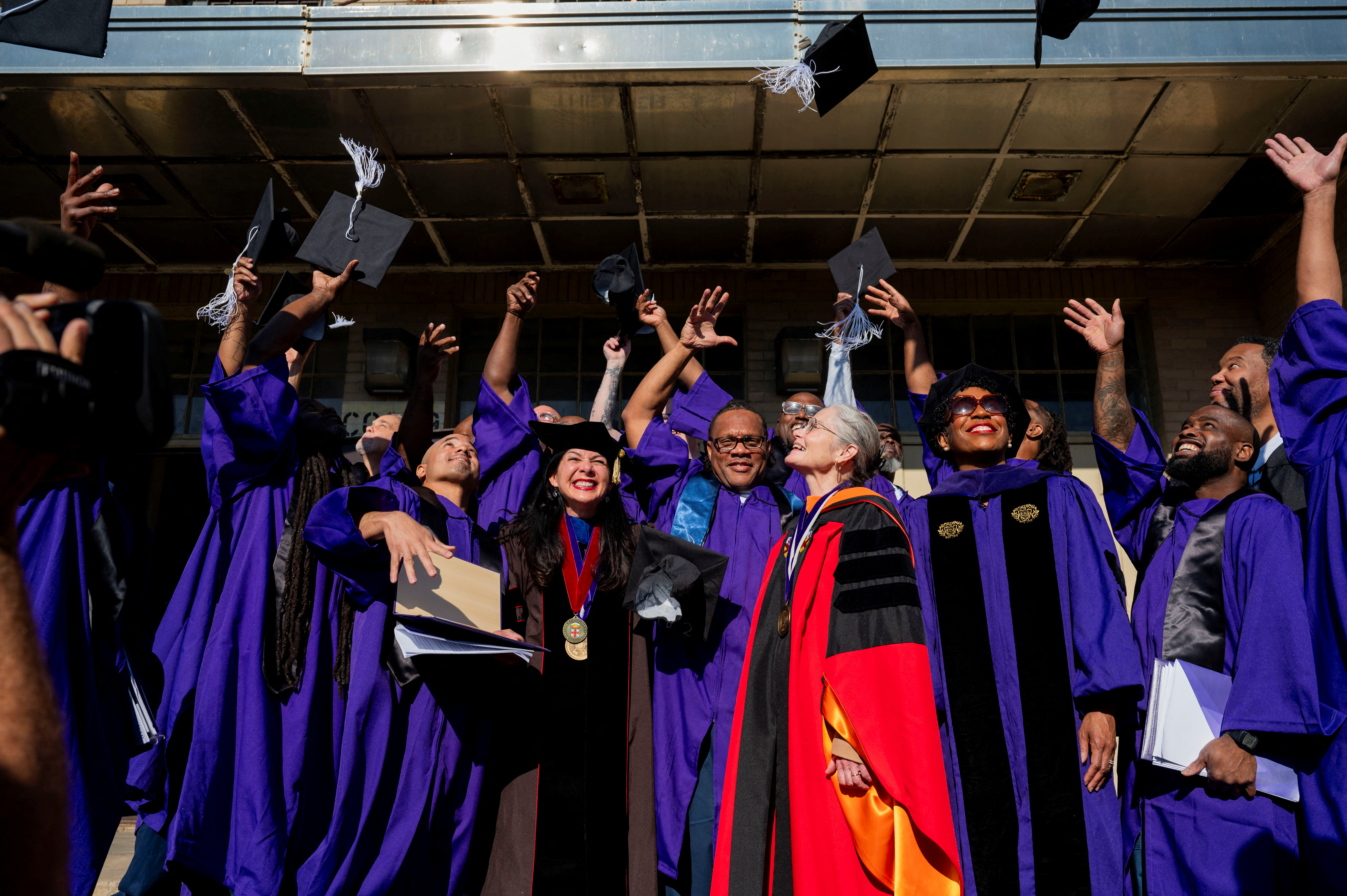 Prisoners cheer after they receive their bachelor's degrees from Northwestern University during a graduation ceremony for students who went through the inaugural class of the Northwestern Prison Education Program at Stateville Correctional Center in Crest Hill, Illinois, U.S., November 15, 2023. 