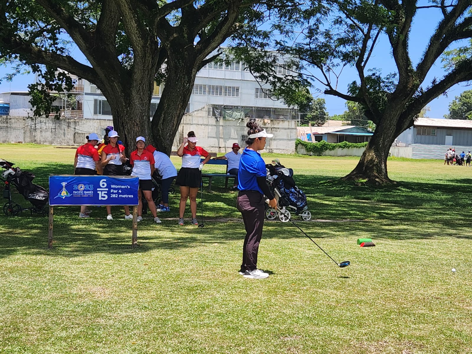 NMI golfer Zhimin Jin takes her time before going for a swing during the opening round of the golf competition in the 2023 Pacific Games at the Honiara Golf Club in the Solomon Islands.