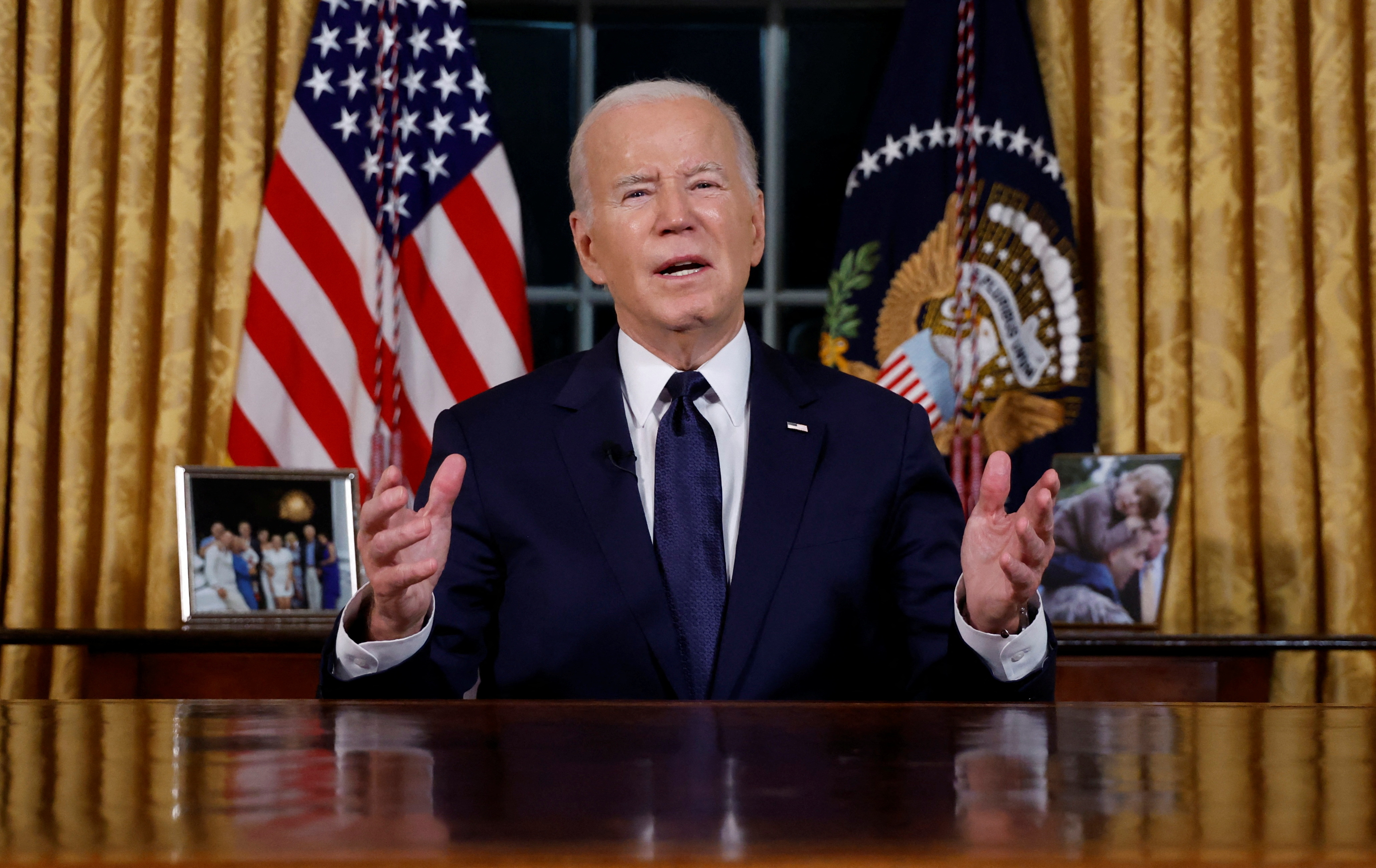U.S. President Joe Biden delivers a prime-time address to the nation about his approaches to the conflict between Israel and Hamas, humanitarian assistance in Gaza and continued support for Ukraine in their war with Russia, from the Oval Office of the White House in Washington, U.S. October 19, 2023. 