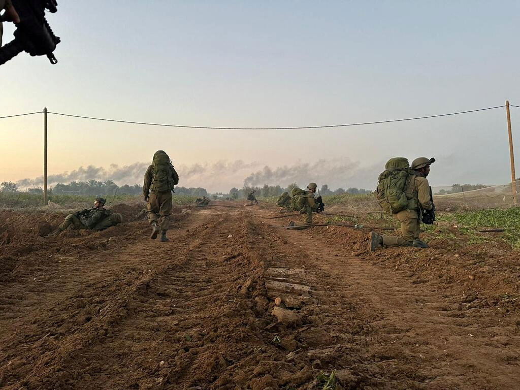 Personnel of the Israel Defense Forces (IDF), take position during ground operations at a location given as Gaza, as the conflict between Israel and the Palestinian Islamist group Hamas continues, in this handout image released on November 1, 2023. 