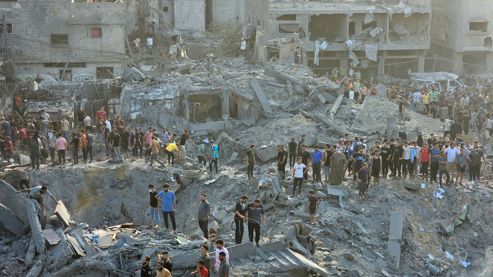 Palestinians search for casualties at the site of Israeli strikes on houses in Jabalia refugee camp in the northern Gaza Strip, October 31, 2023.