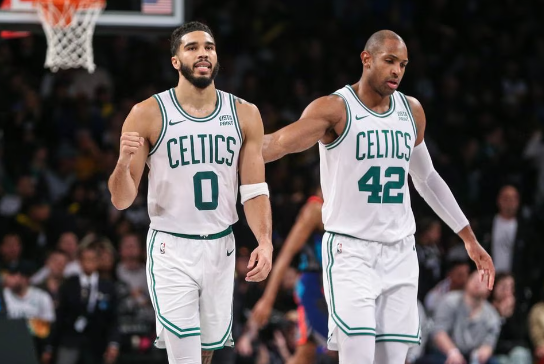 Boston Celtics forward Jayson Tatum (0) and center Al Horford (42) walk back to the bench after the Brooklyn Nets call a time out in the fourth quarter at Barclays Center in Brooklyn, New York, Nov. 4, 2023.