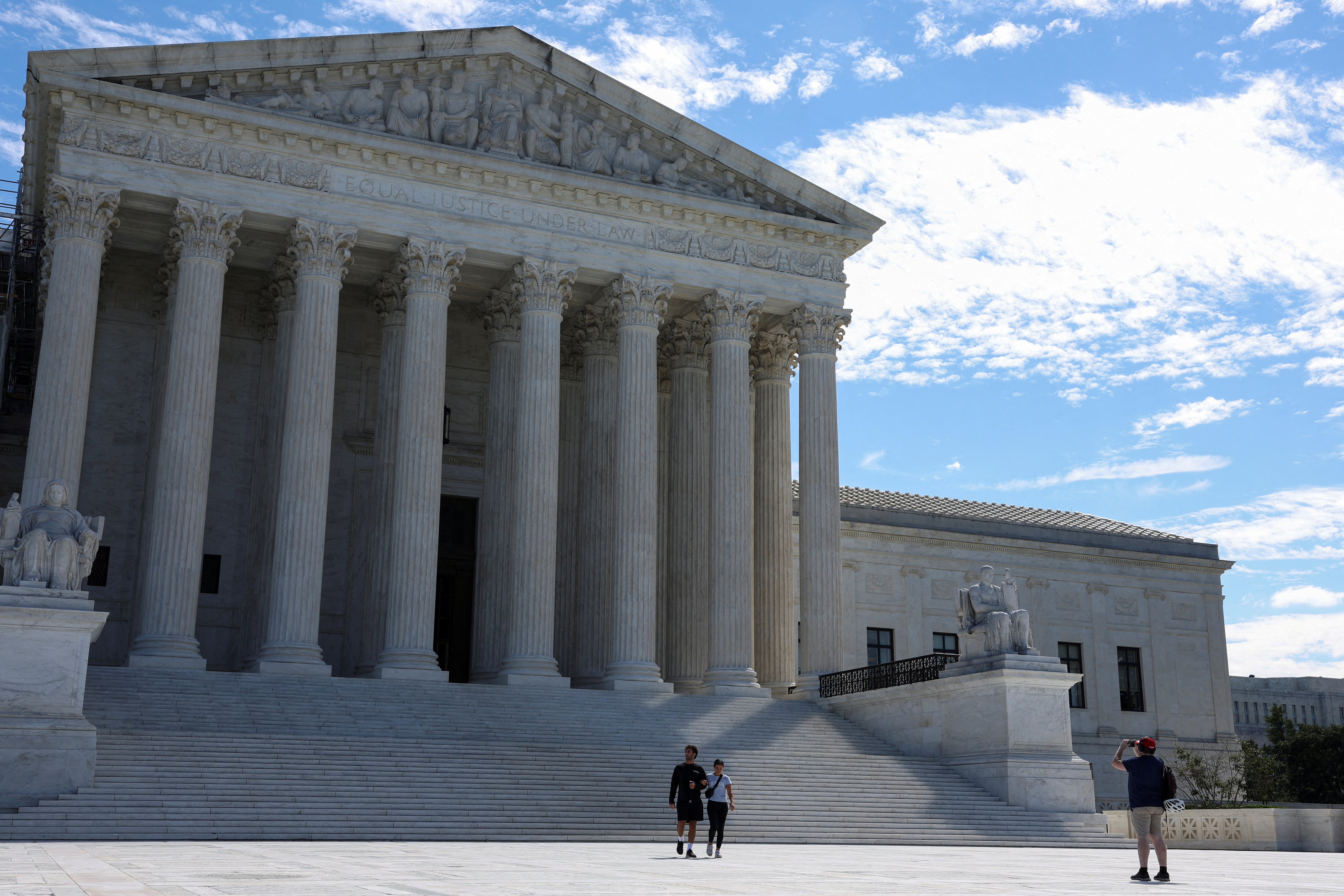 People visit the U.S. Supreme Court building in Washington, U.S., August 31, 2023. 