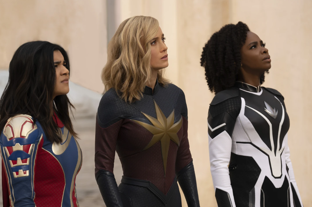 From left, Iman Vellani as Ms. Marvel, Brie Larson as Captain Marvel and Teyonah Parris as Captain Monica Rambeau in a scene from “The Marvels.”