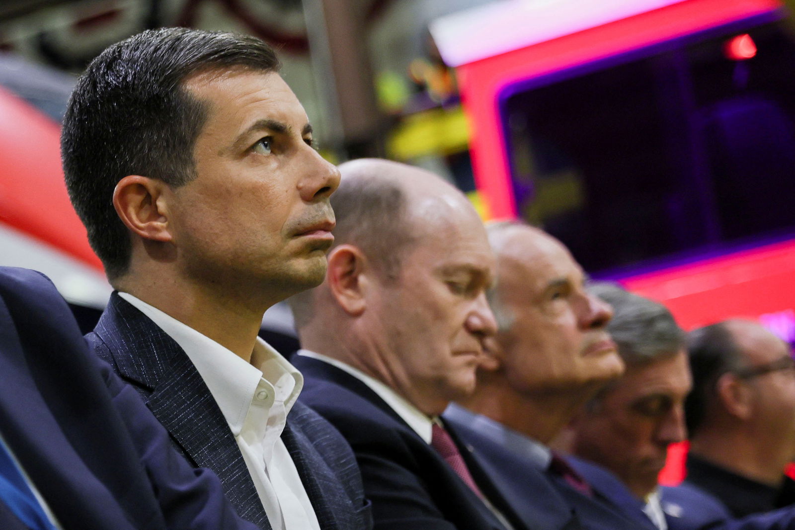 Secretary of Transportation Pete Buttigieg listens as U.S. President Joe Biden delivers remarks on infrastructure during an event at the Amtrak maintenance facility in Bear, Delaware, U.S., November 6, 2023. 