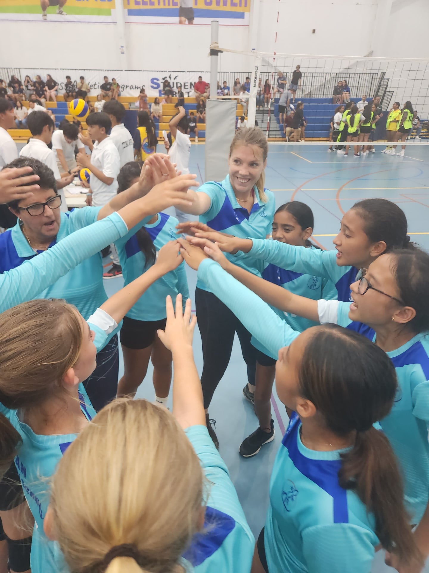 Saipan International School players and coaches huddle after their victory in a girls middle school division game of the NMIVA-PSS Interscholastic Volleyball League SY23-24 Thursday at the Marianas High School gym.