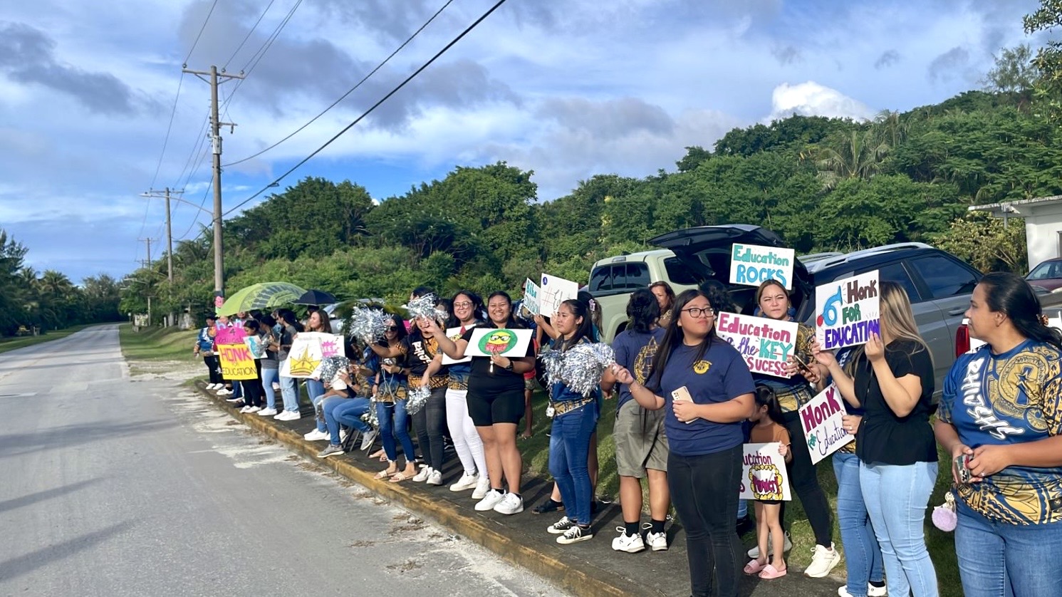 On Rota, Dr. Rita Hocog Inos Junior Senior High School and Sinapalo Elementary School staff and personnel held their roadside event at 4 p.m. Monday.
