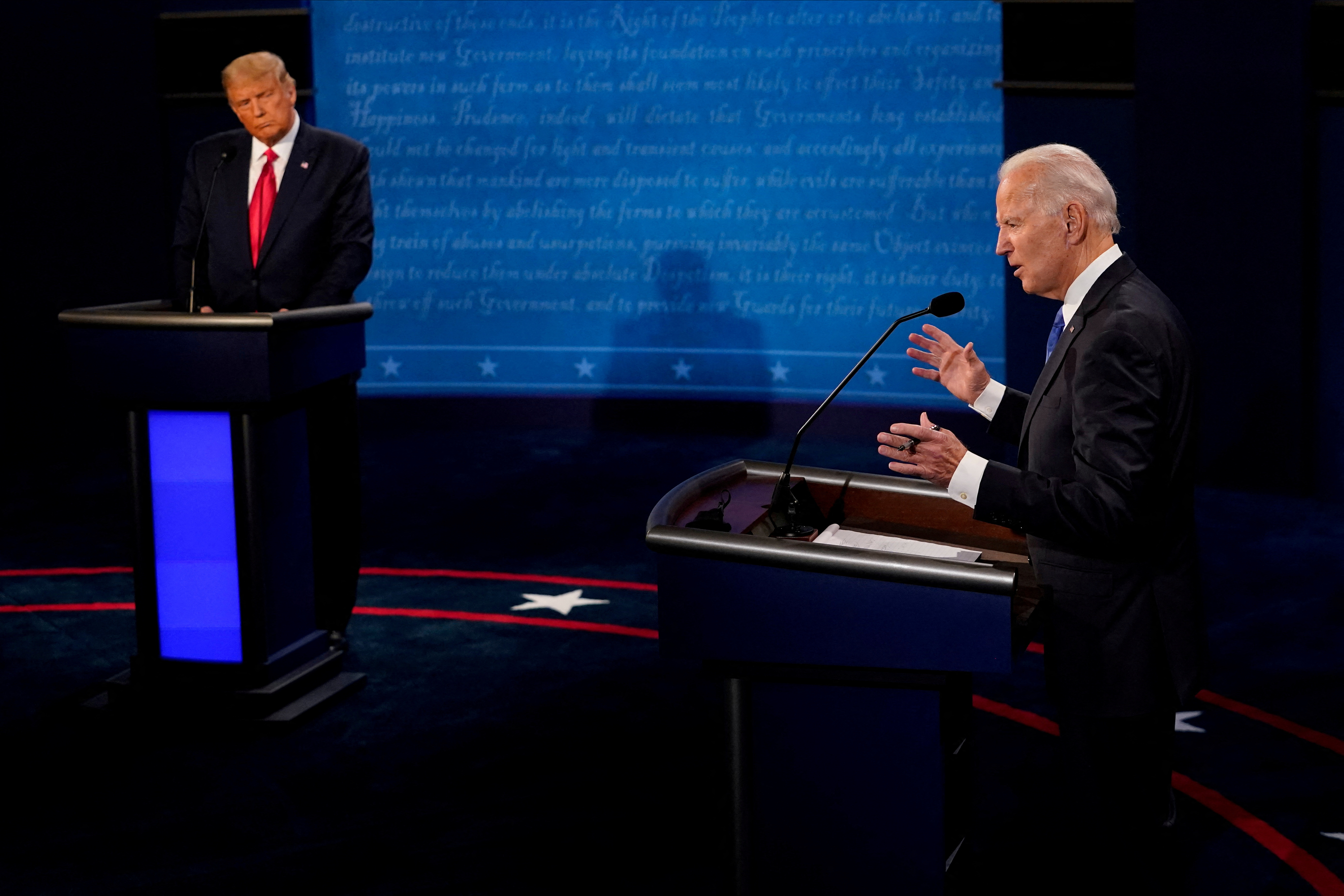 Democratic presidential candidate Joe Biden answers a question as Republican Donald Trump listens during the second and final presidential debate at the Curb Event Center at Belmont University in Nashville, Tennessee, Oct. 22, 2020.