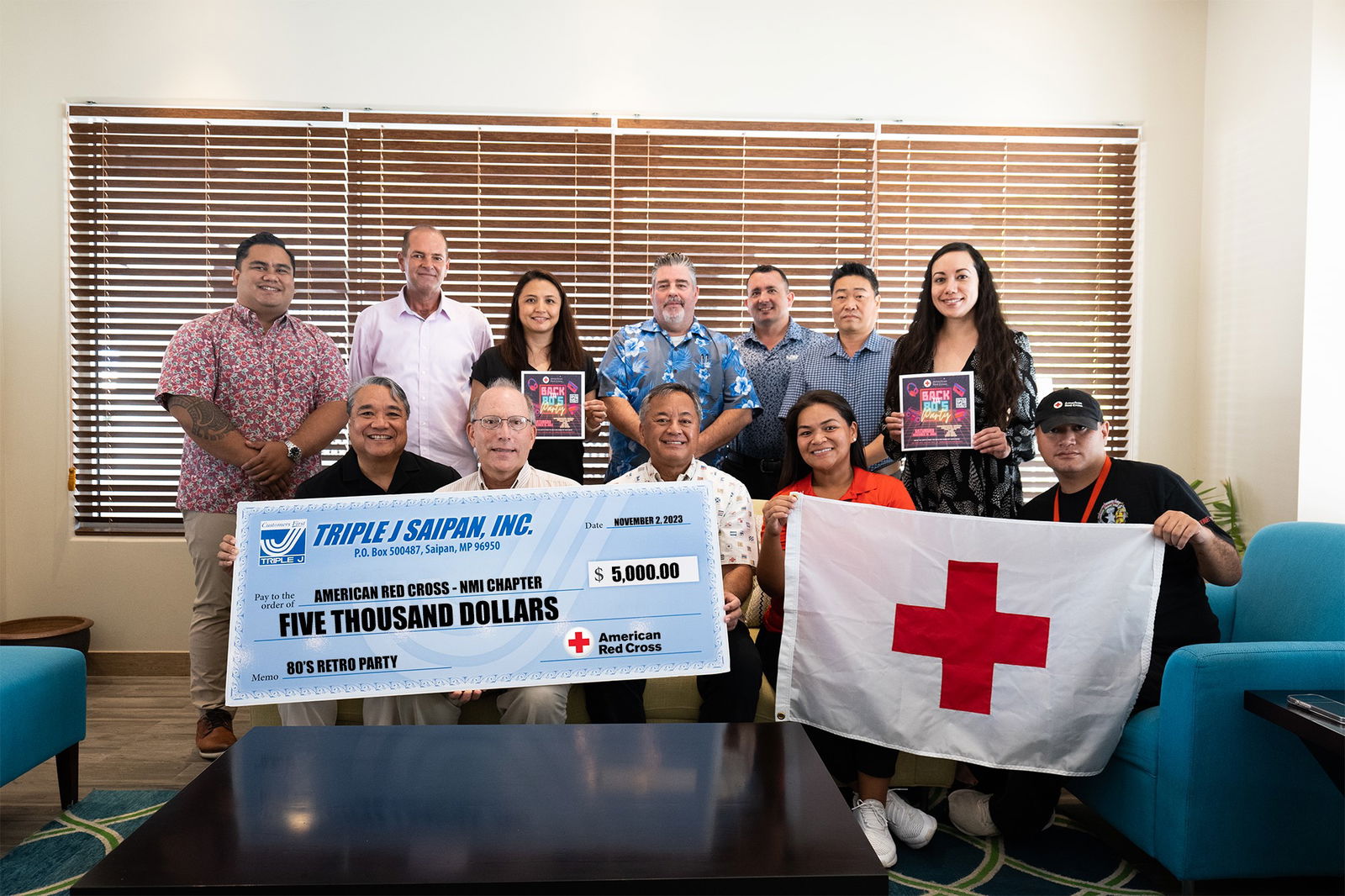 Front row, Francisco S. Ada (Director Human Resources), John Hirsh  (American Red Cross-NMI Chapter Executive Director), Michael S. Sablan (Vice President), Selmalyn Taitano (Red Cross Business Manager), Luis Crisostomo (Disaster Services volunteer); second row, Jose S.P. Mafnas (Corporate Legal Counsel), James Herbert (General Manager, Five Star Wholesale Foods, Guam), Kina Ann Peter (Corporate Controller), Rocco Valentino (Managing Director for Surf Club, Great Harvest & Surfrider), Brad Ruszala (Marketing Manager), Keith Ahn (General Manager, Surfrider Resort Hotel), and Patty Palacios (Red Cross Board Member).