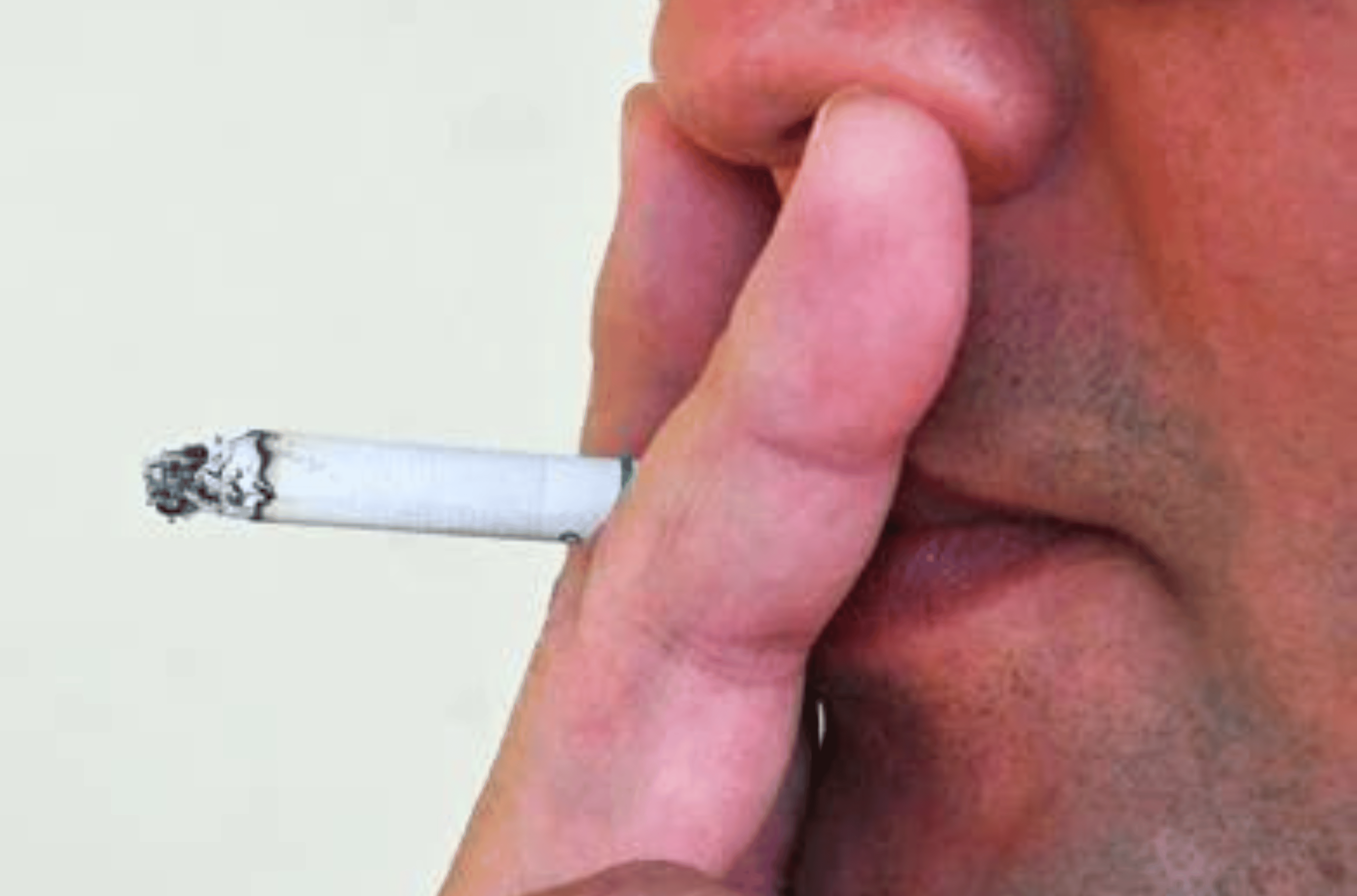 A person takes a drag on his cigarette Monday, Oct. 16, 2023, in Hagåtña. 