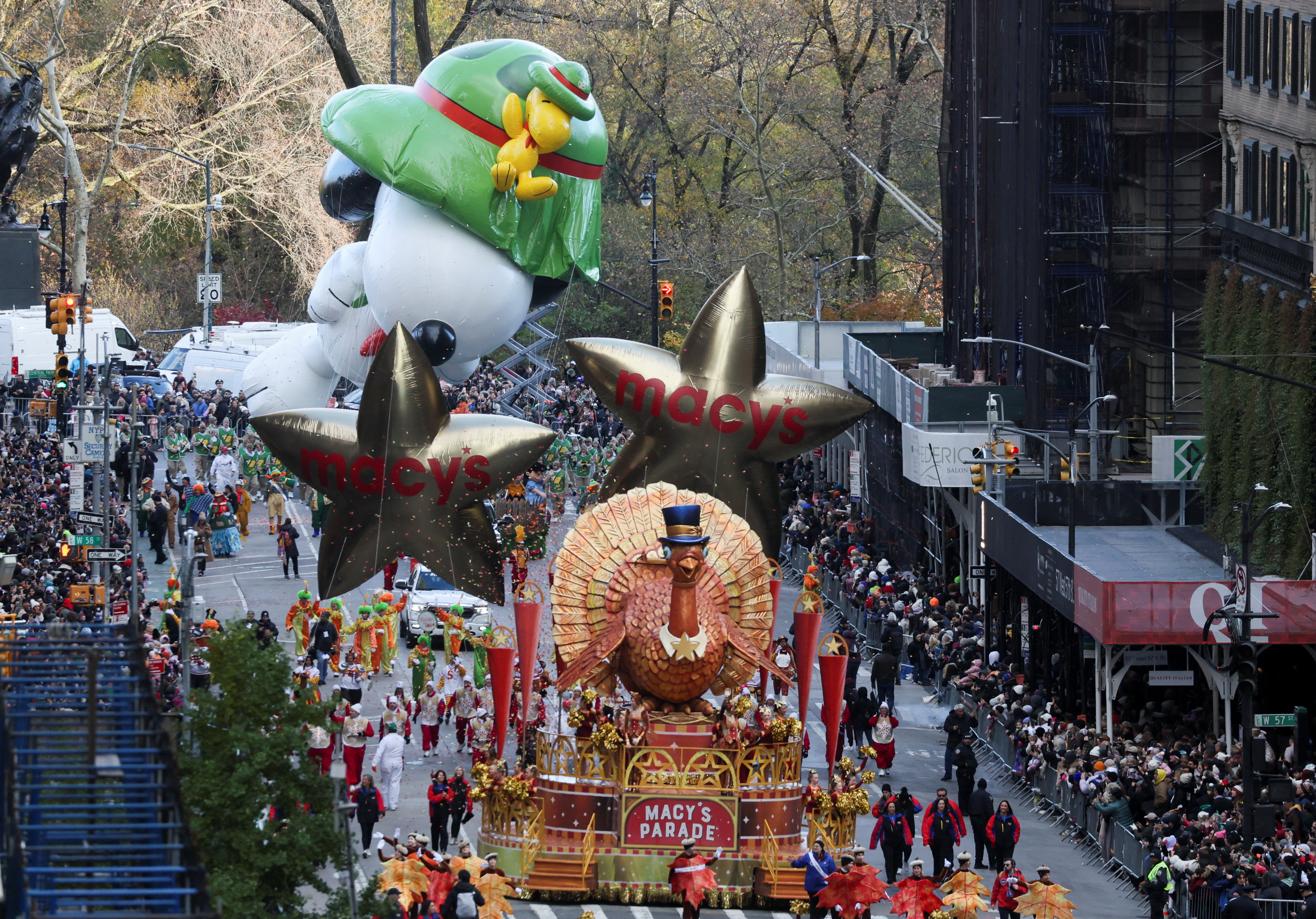 Beagle scout Snoopy balloon flies, as Tom Turkey float rides during the 97th Macy's Thanksgiving Day Parade in Manhattan, New York City, U.S., November 23, 2023. 