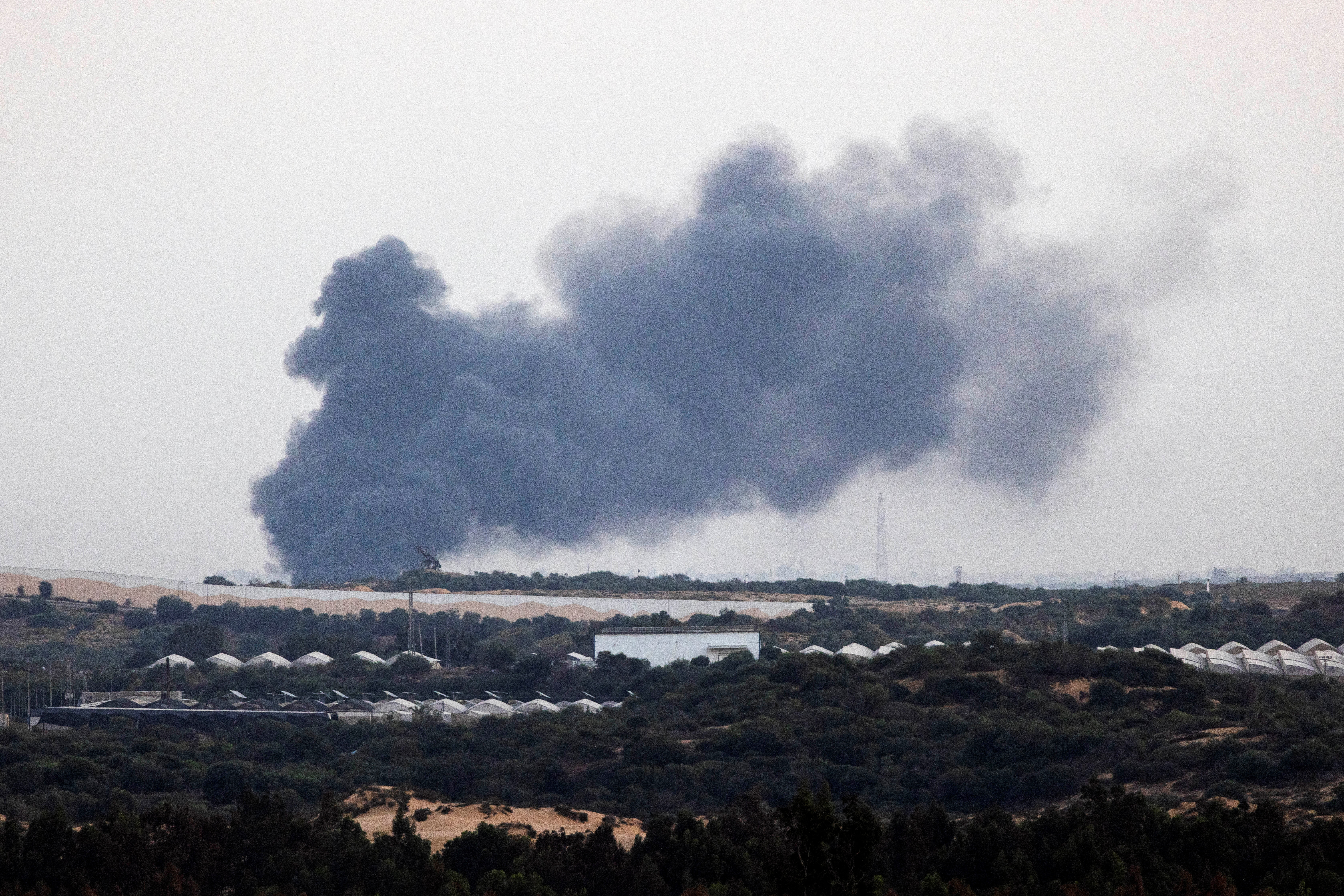 Smoke rises above the Gaza Strip, amid the ongoing conflict between Israel and the Palestinian Islamist group Hamas, as seen from Israel's border with Gaza in southern Israel, November 4, 2023. 