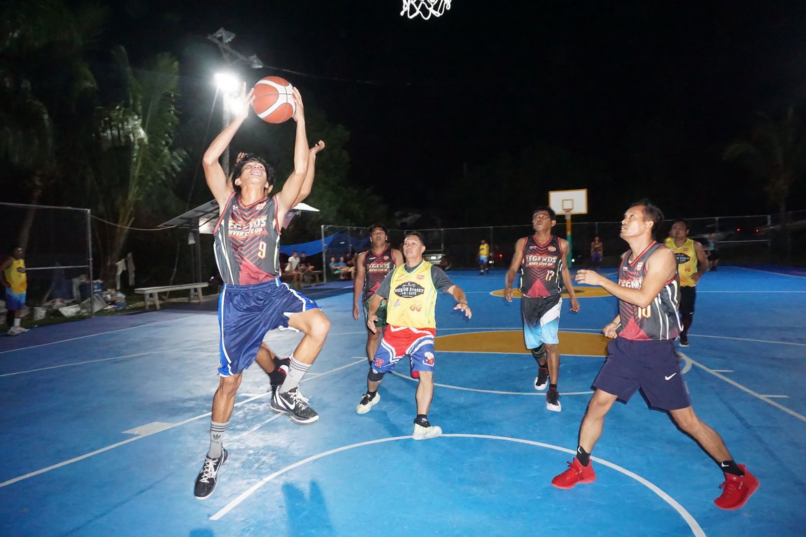 Team Legends' Jimboy Tabora goes up for the shot during a game of the 2023 Pacific Saipan Promo Invitational Basketball League at the Gualo Rai basketball court on Friday.