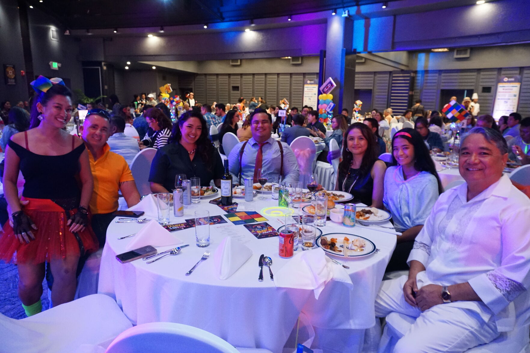 Francisco Ada, seated right, with Triple J executives and loved ones.