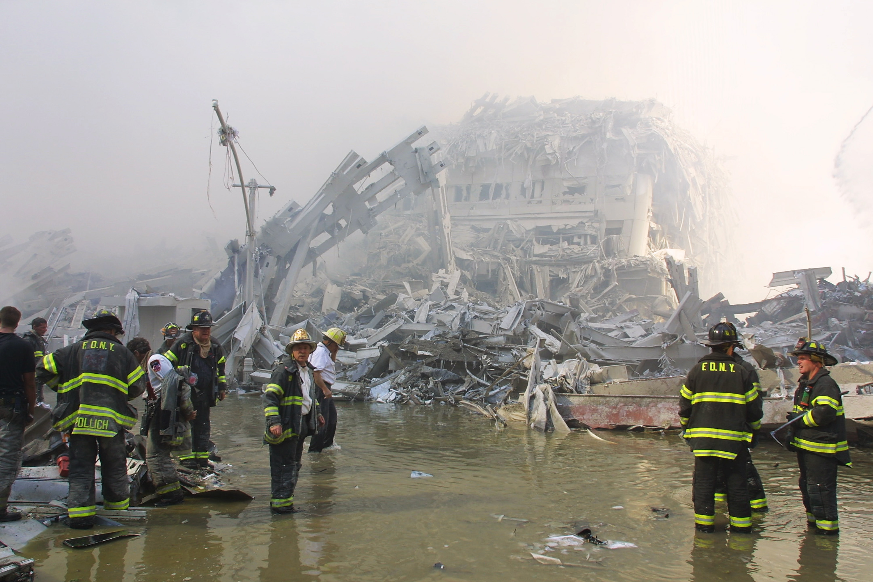 New York City firefighters work at the World Trade Center after two hijacked planes crashed into the Twin Towers on Sept. 11, 2001, in New York. (Ron Agam/Getty Images/TNS)