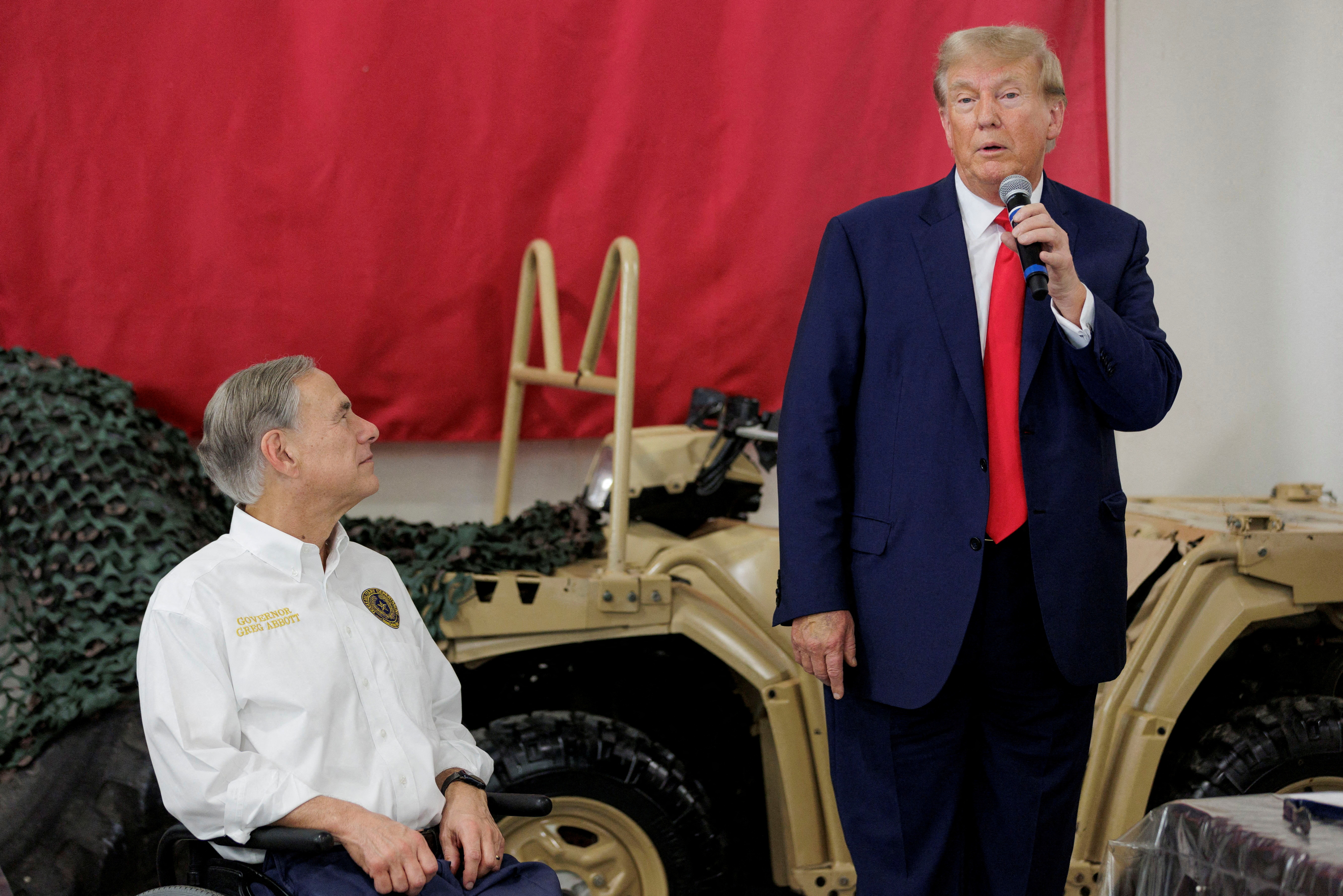 Republican presidential candidate and former U.S. President Donald Trump speaks alongside Texas Governor Greg Abbott at the South Texas International airport in Edinburg, Texas, U.S. November 19, 2023. 
