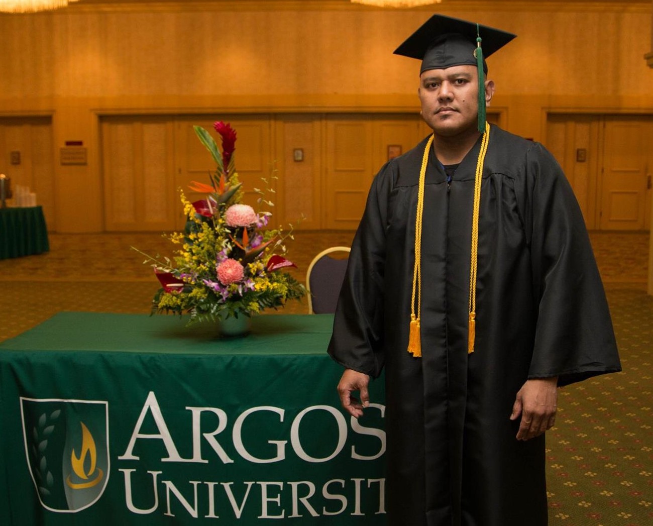Marvin I. Deleon Guerrero poses for a photo during a graduation ceremony at Argosy University in Honolulu, Hawaii.