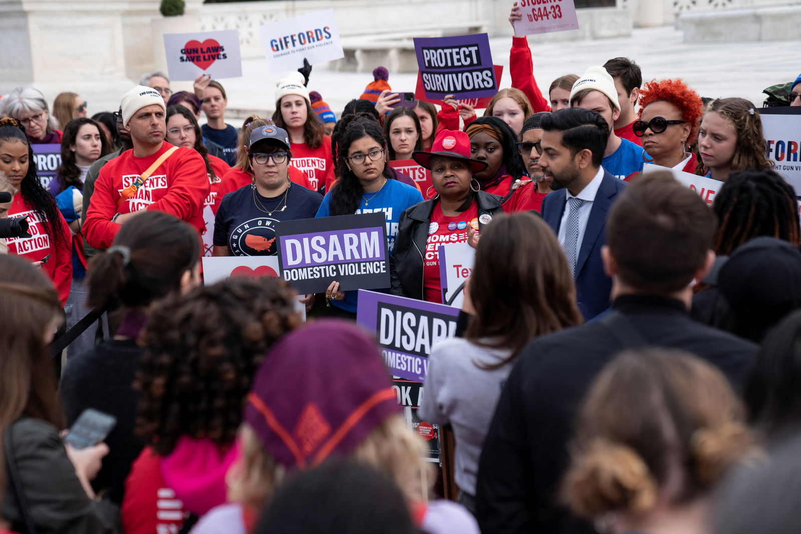 People participate in a demonstration as the US Supreme Court considers legality of domestic-violence gun curbs at the Supreme Court in Washington, D.C., U.S., November 7, 2023. 