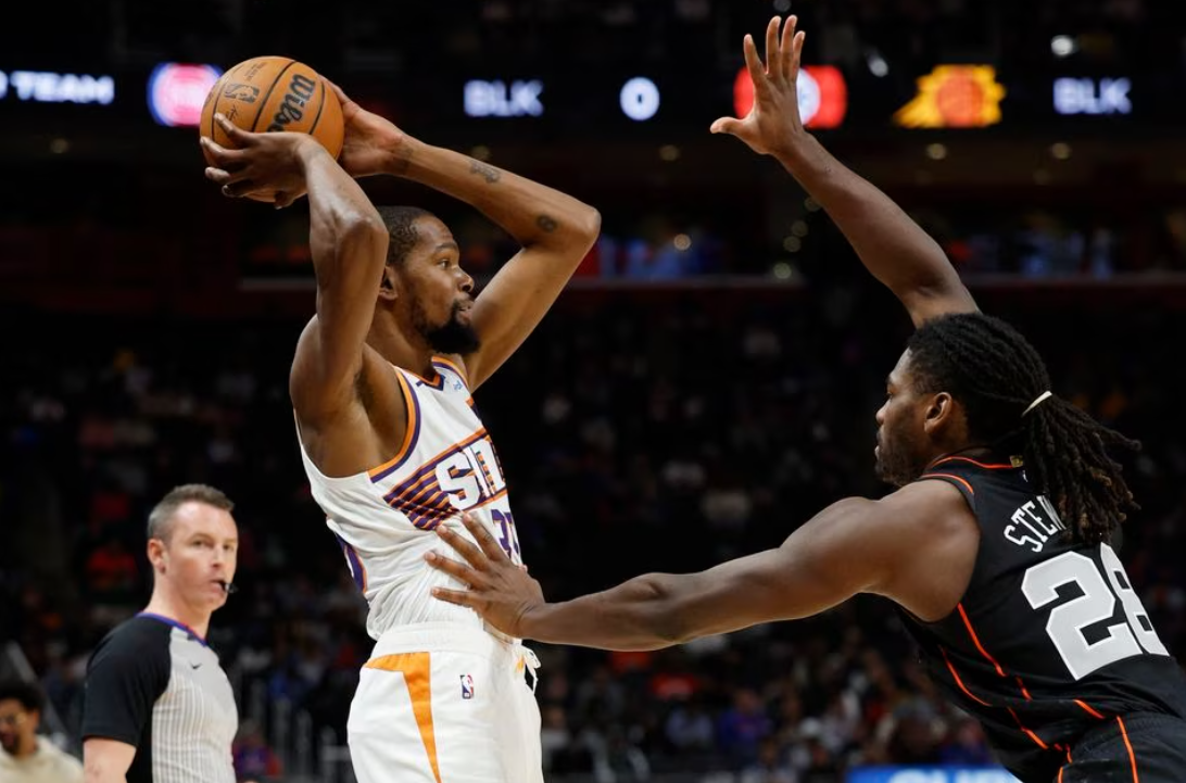 Phoenix Suns forward Kevin Durant (35) is defended by Detroit Pistons center Isaiah Stewart (28) in the first half at Little Caesars Arena in Detroit, Michigan, Nov. 5, 2023.