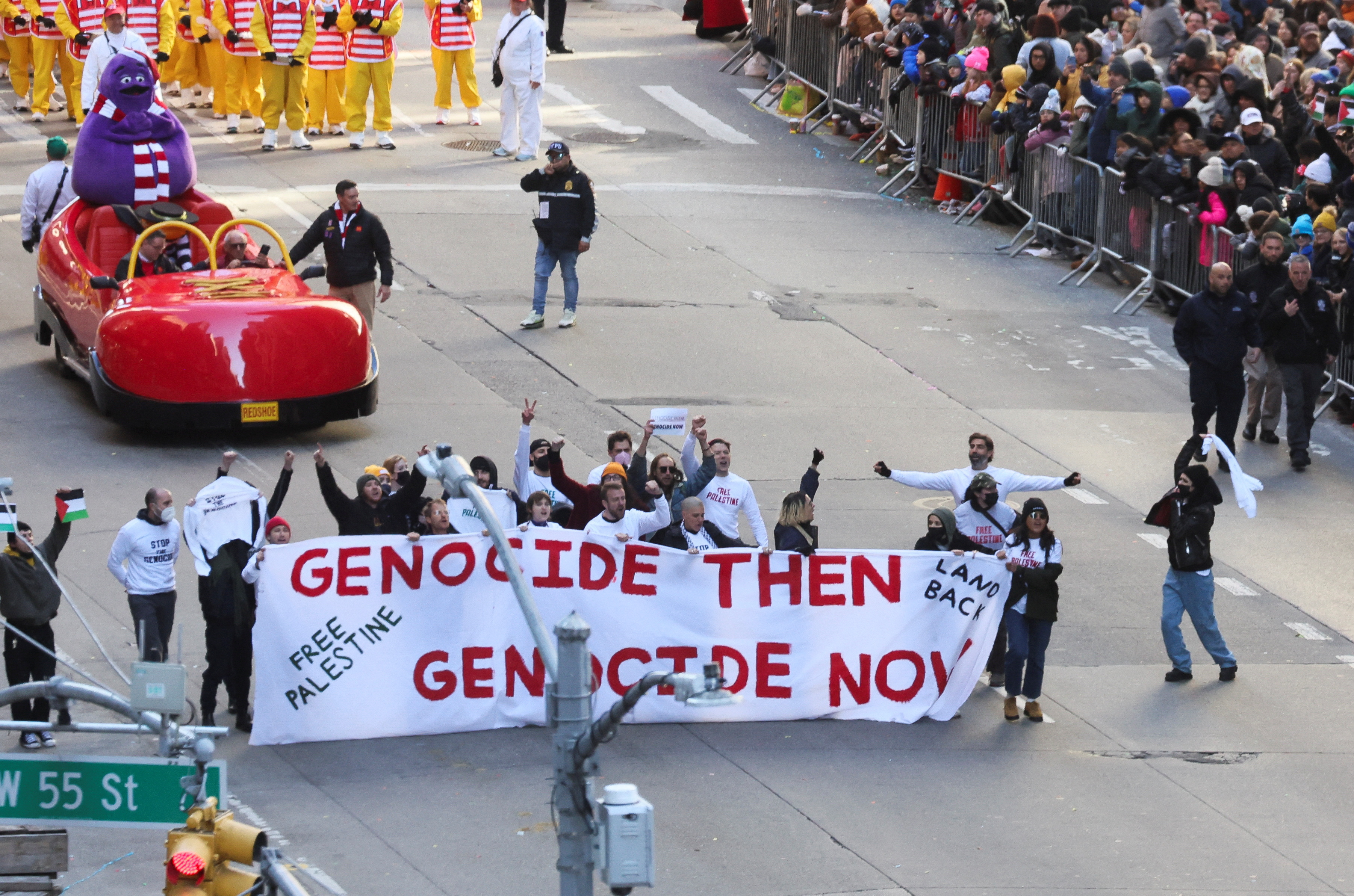 People demonstrate during the 95th Macy's Thanksgiving Day Parade, in Manhattan, New York City, U.S., November 23, 2023. 