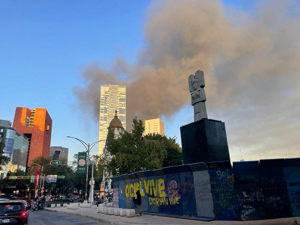 Smoke from a fire rises out of a shoe warehouse near Zocalo in Mexico City, Mexico November 16, 2023. 