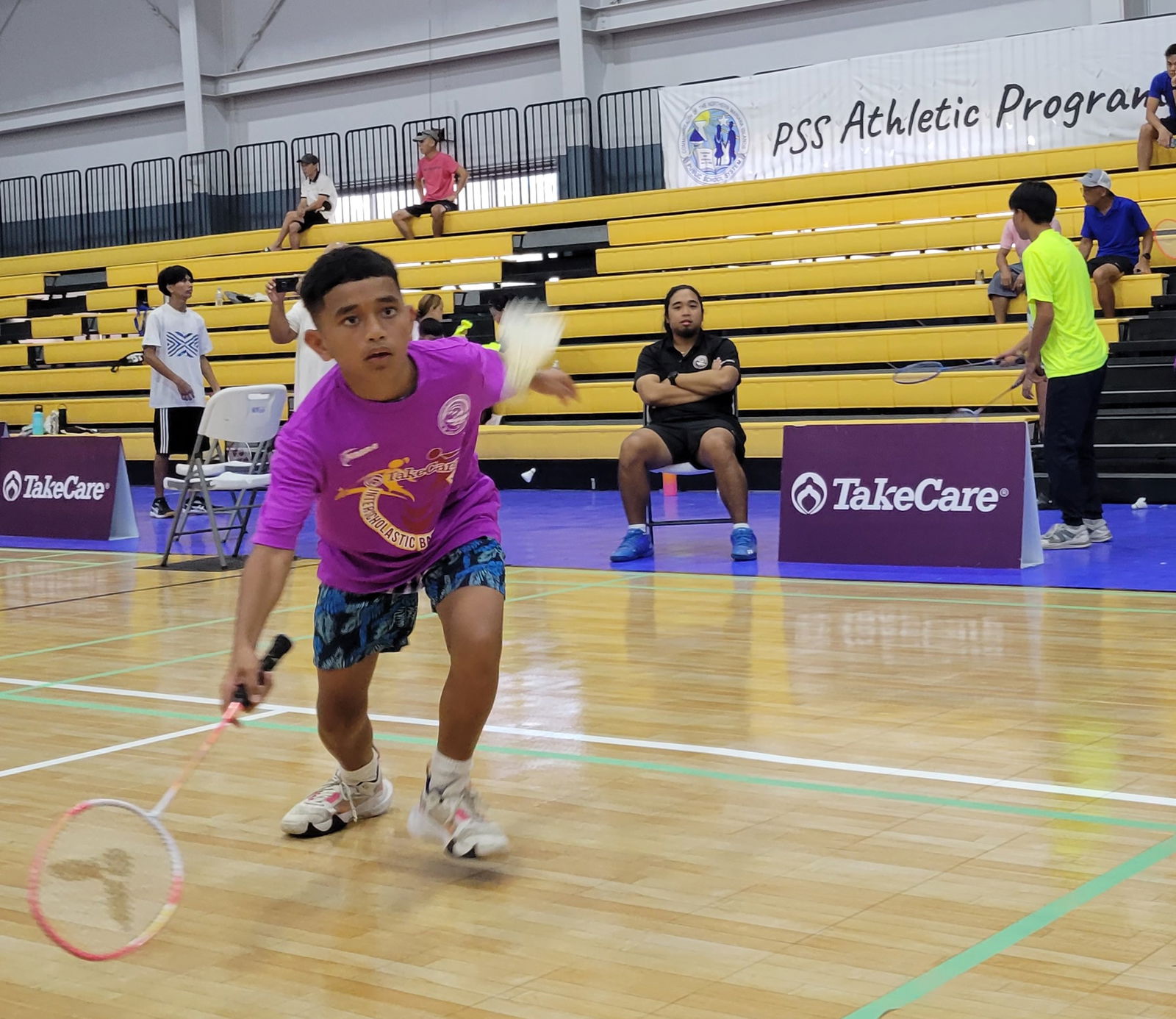 A Francisco M. Sablan Middle School student reaches for the shuttlecock to return to his foe from Chacha Oceanview Middle School during one of the opening games in the TakeCare Interscholastic Badminton League last Saturday at the Gilbert C. Ada Gymnasium.