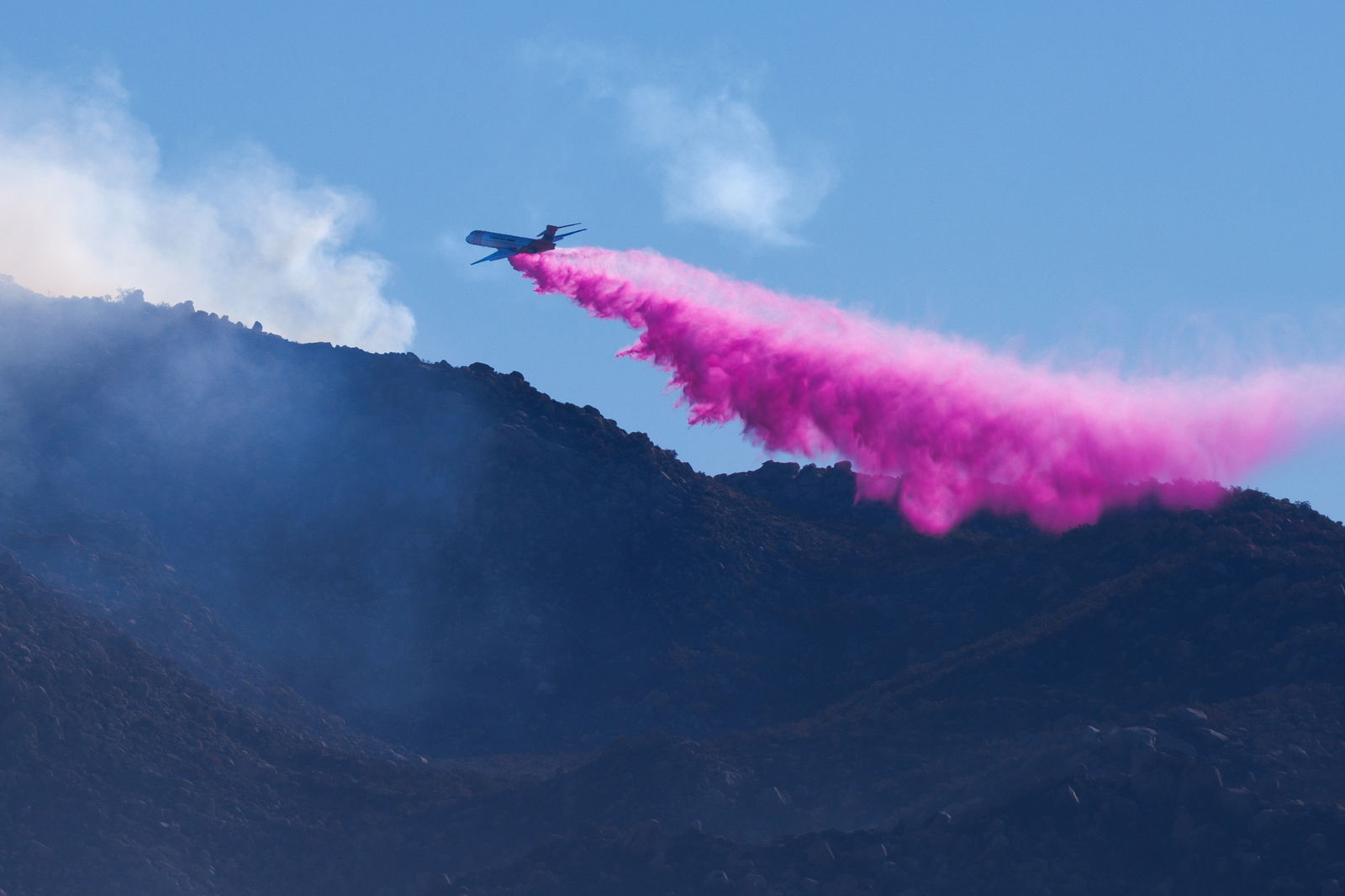 Firefighters attack from the air with a retardant drop as they battle the Highland Fire, a wind- driven wildfire near Aguanga, California, U.S.,October 31, 2023. 