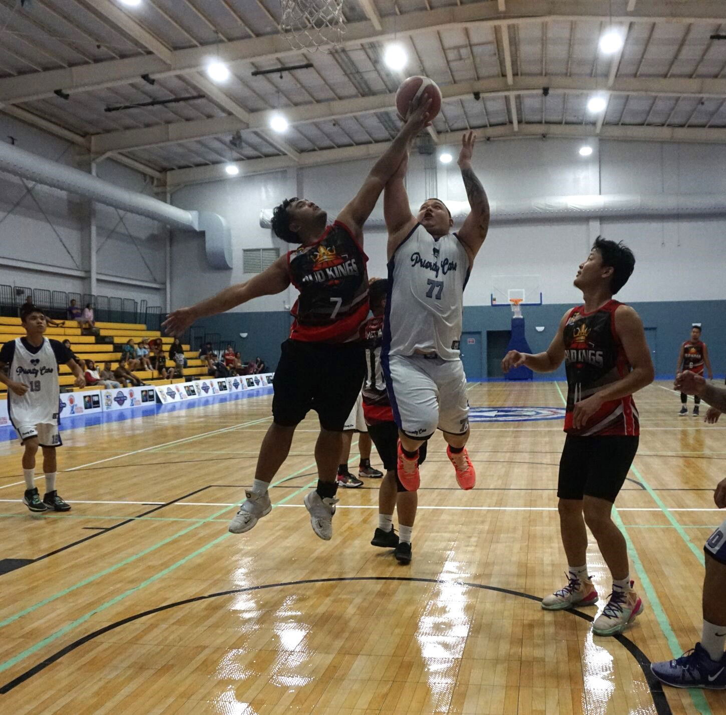 Marpac's Greg Sablan attempts the block against Priority Care's Matt Duenas during a semifinal game of the 2023 R&J Wine and Liquor Inter-Government/Business League at the Ada gym on Thursday.