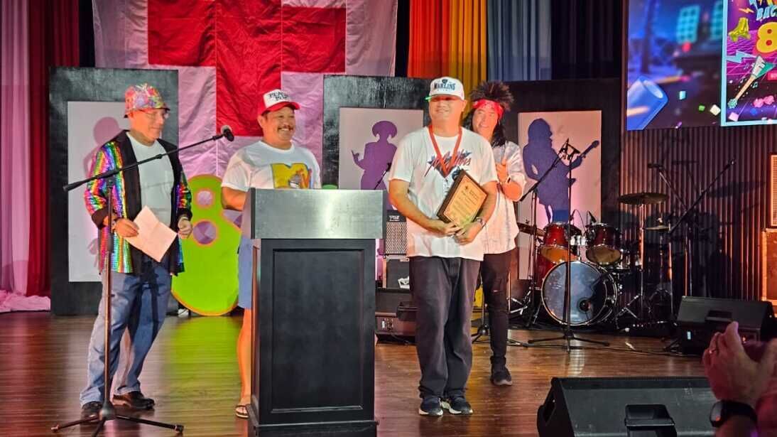 Volunteer Luis Crisostomo Jr. receives a plaque of recognition from the American Red Cross-NMI Chapter at Kensington Hotel on Saturday evening, Nov. 18, 2023.