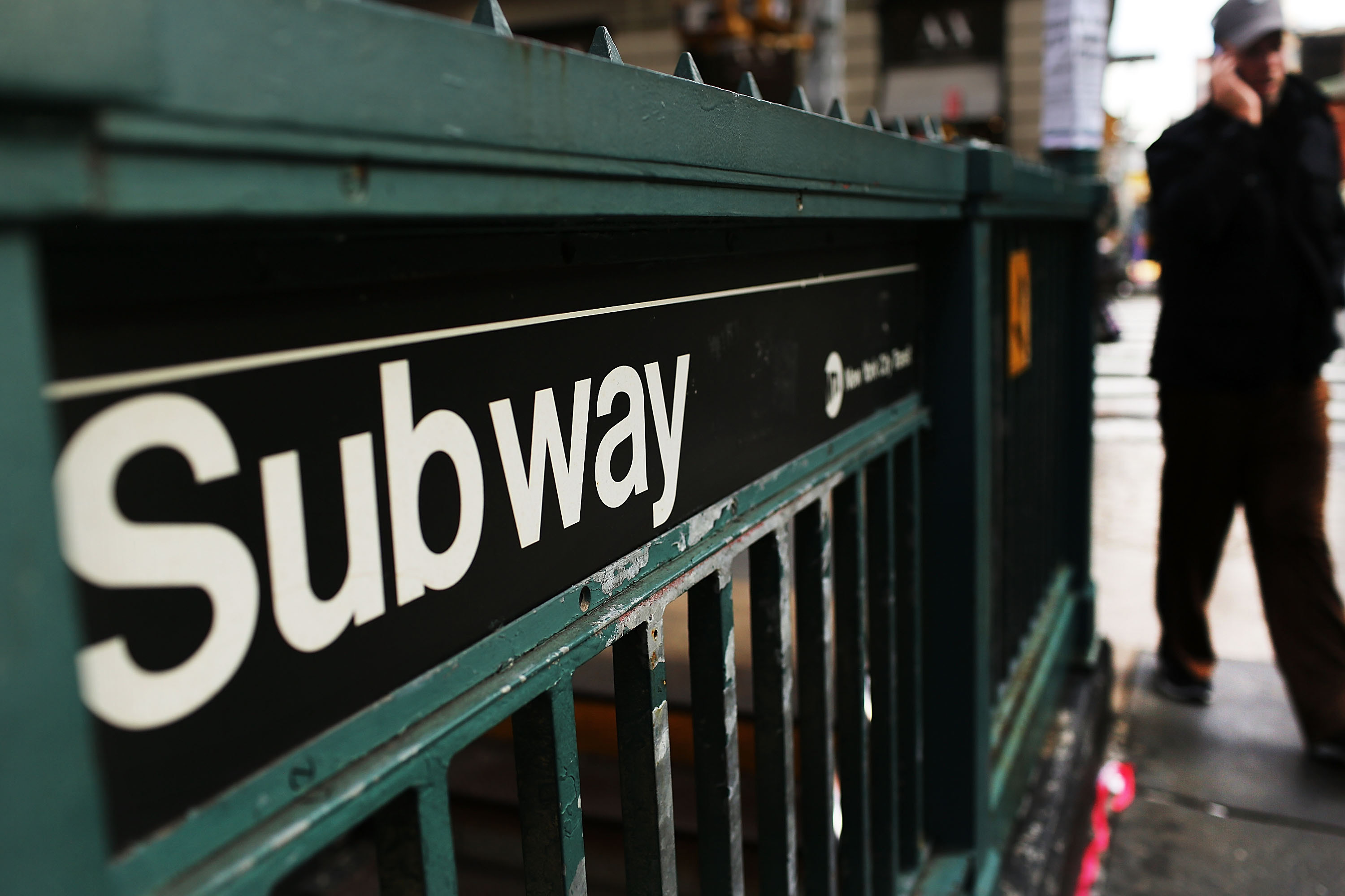 A man walks past a subway stop in Manhattan two days after a man was pushed to his death in front of a train on Dec. 5, 2012 in New York City. A Florida manâ€™s social media posts threatening a mass shooting on the <a href="https://new.mta.info/agency/new-york-city-transit" id="link-54946647450d8b2e8a9294c2ab563f9b">New York City subway</a> landed him in jail, authorities said Friday, Nov. 24, 2023.(Spencer Platt/Getty Images/TNS)