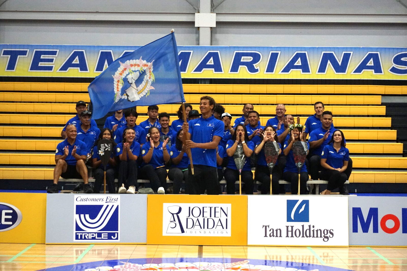 Isaiah Aleksenko raises the CNMI flag after being chosen as the Team Marianas flagbearer in the 2023 Pacific Games, which will be held in Honiara, the Solomon Islands from Nov. 19 to Dec. 2.