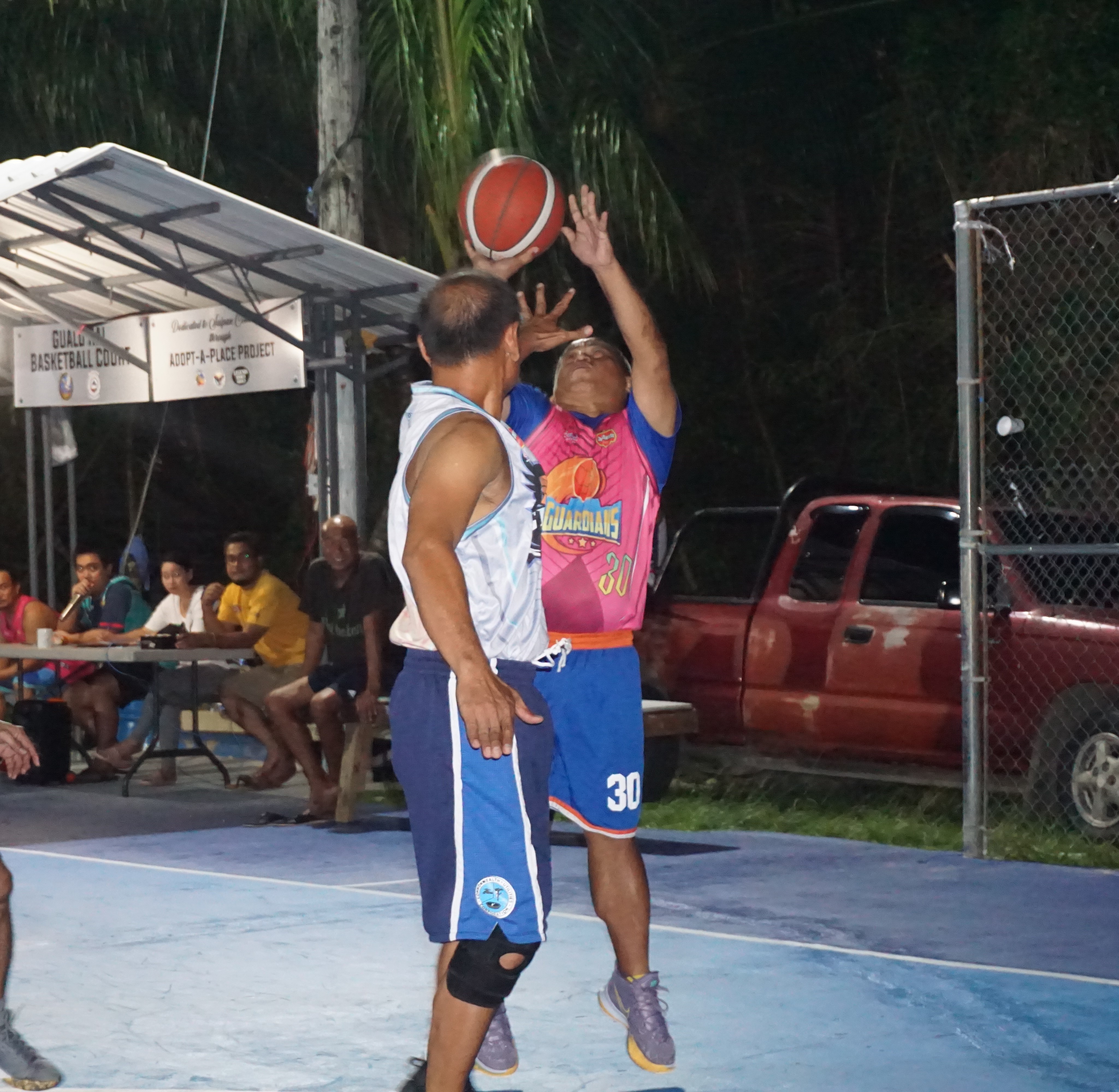 The Guardians' Jerome Directo protects the ball as he goes up for the finish during a game of the 2023 Pacific Saipan Promo Invitational Basketball League at the Gualo Rai basketball court on Wednesday.