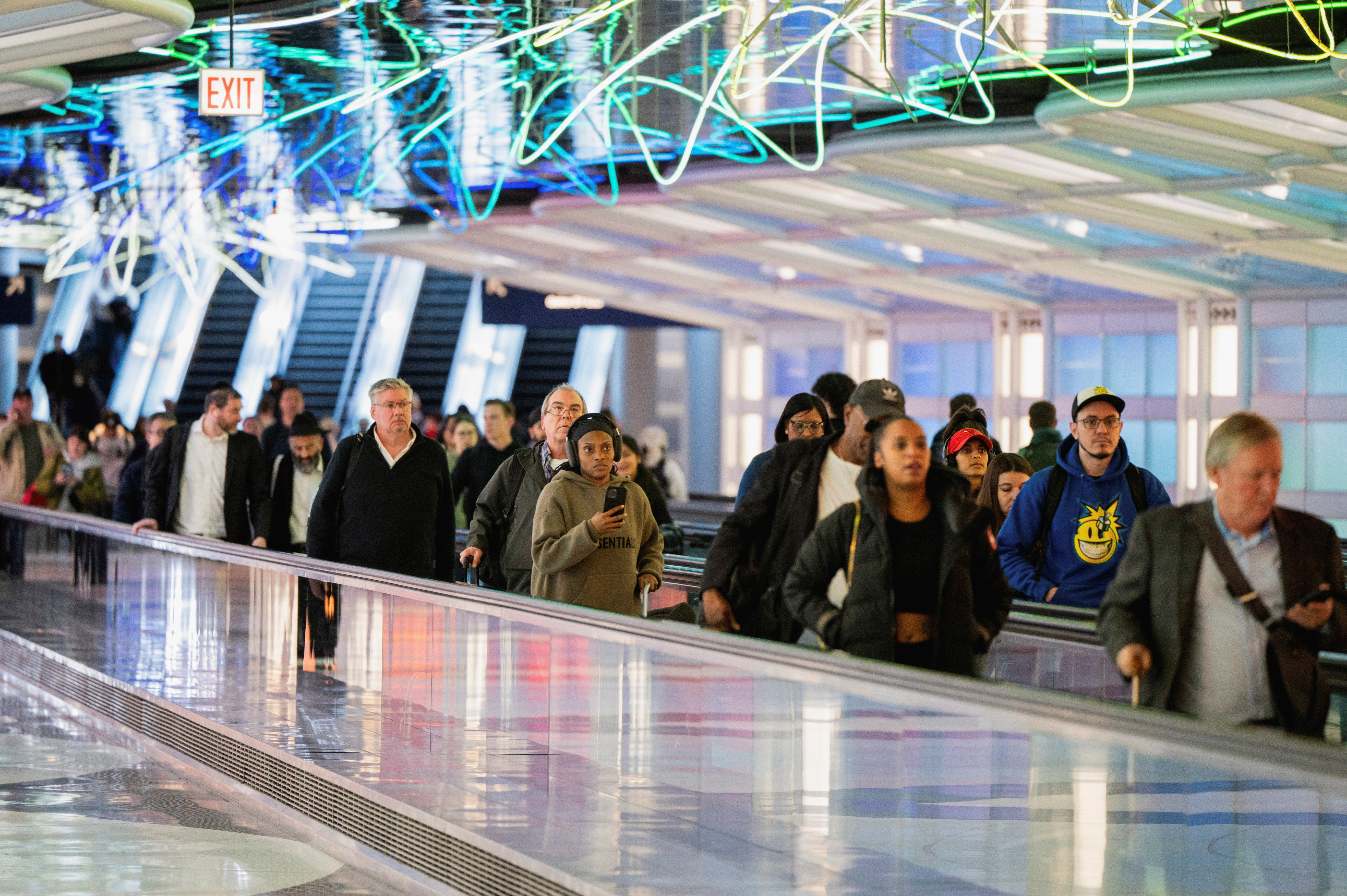 People go to their flight gates ahead of the Thanksgiving holiday at O’Hare International Airport in Chicago, Illinois, U.S. November 22, 2023. 
