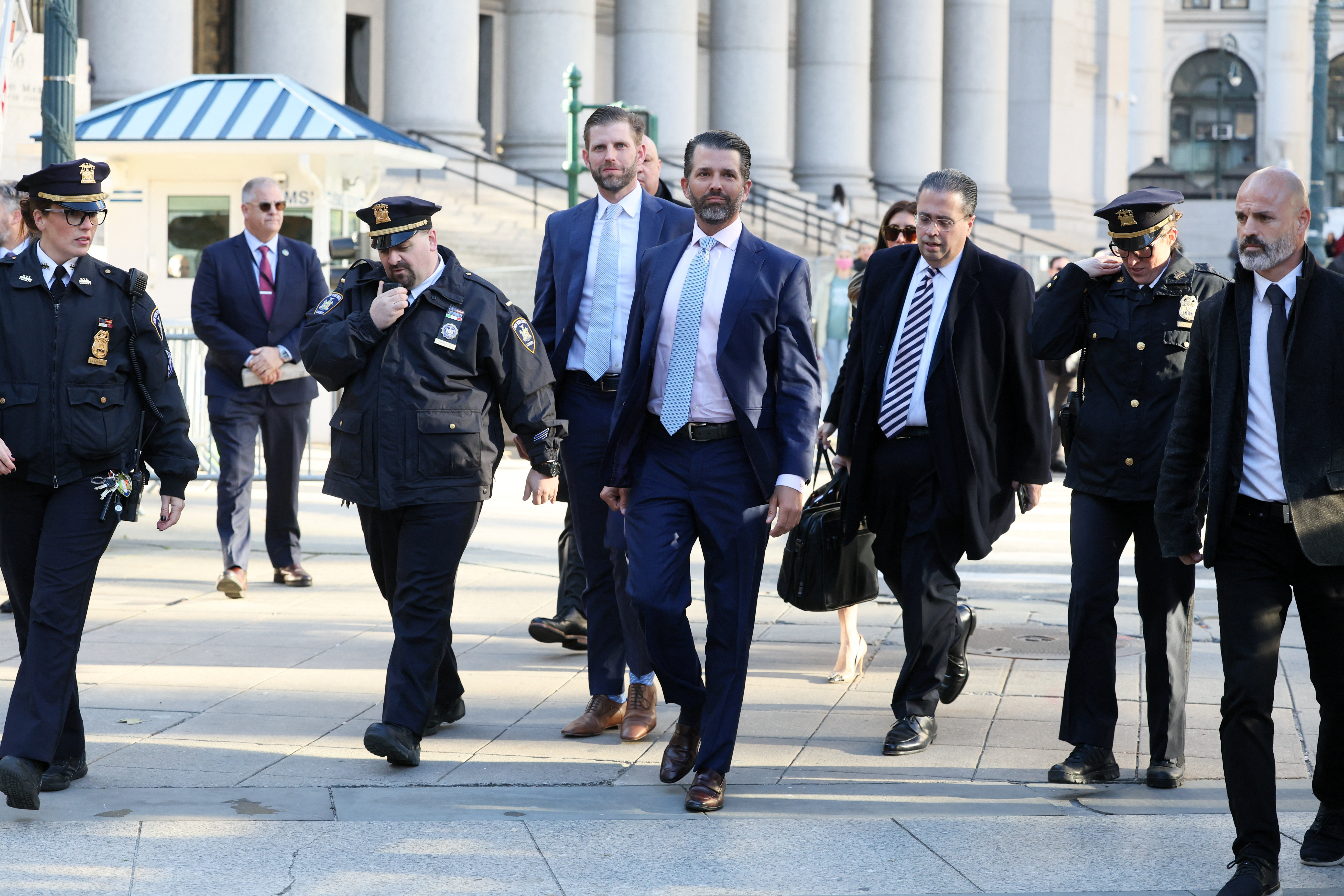 Former U.S. President Donald Trump's sons and co-defendants Donald Trump Jr., and Eric Trump walk to attend the Trump Organization civil fraud trial, in New York State Supreme Court in the Manhattan borough of New York City, U.S., November 2, 2023. 