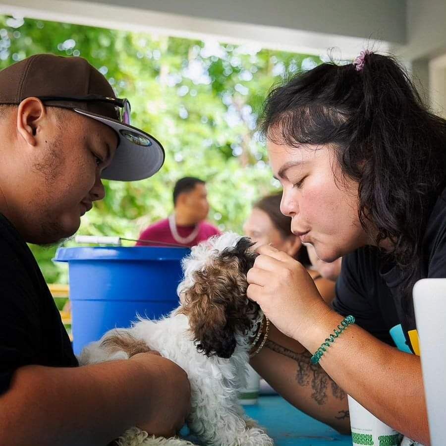 SHS Philanthropy Director Lupe Attao gives kisses to a patient.