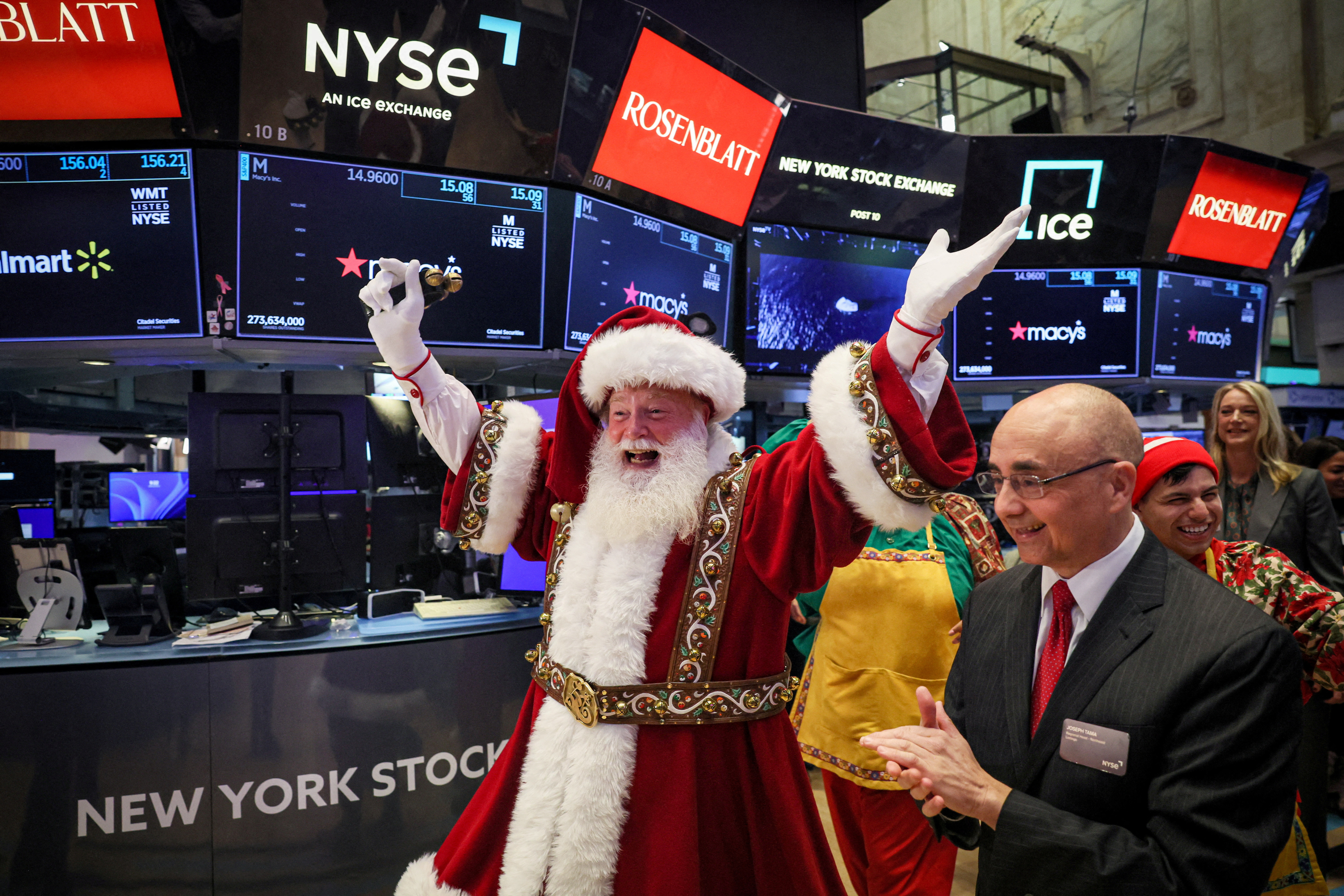 Macy's Santa Claus appears on the trading floor to celebrate the 97th Macy's Thanksgiving Day Parade at the New York Stock Exchange (NYSE) in New York City, U.S., November 22, 2023. 
