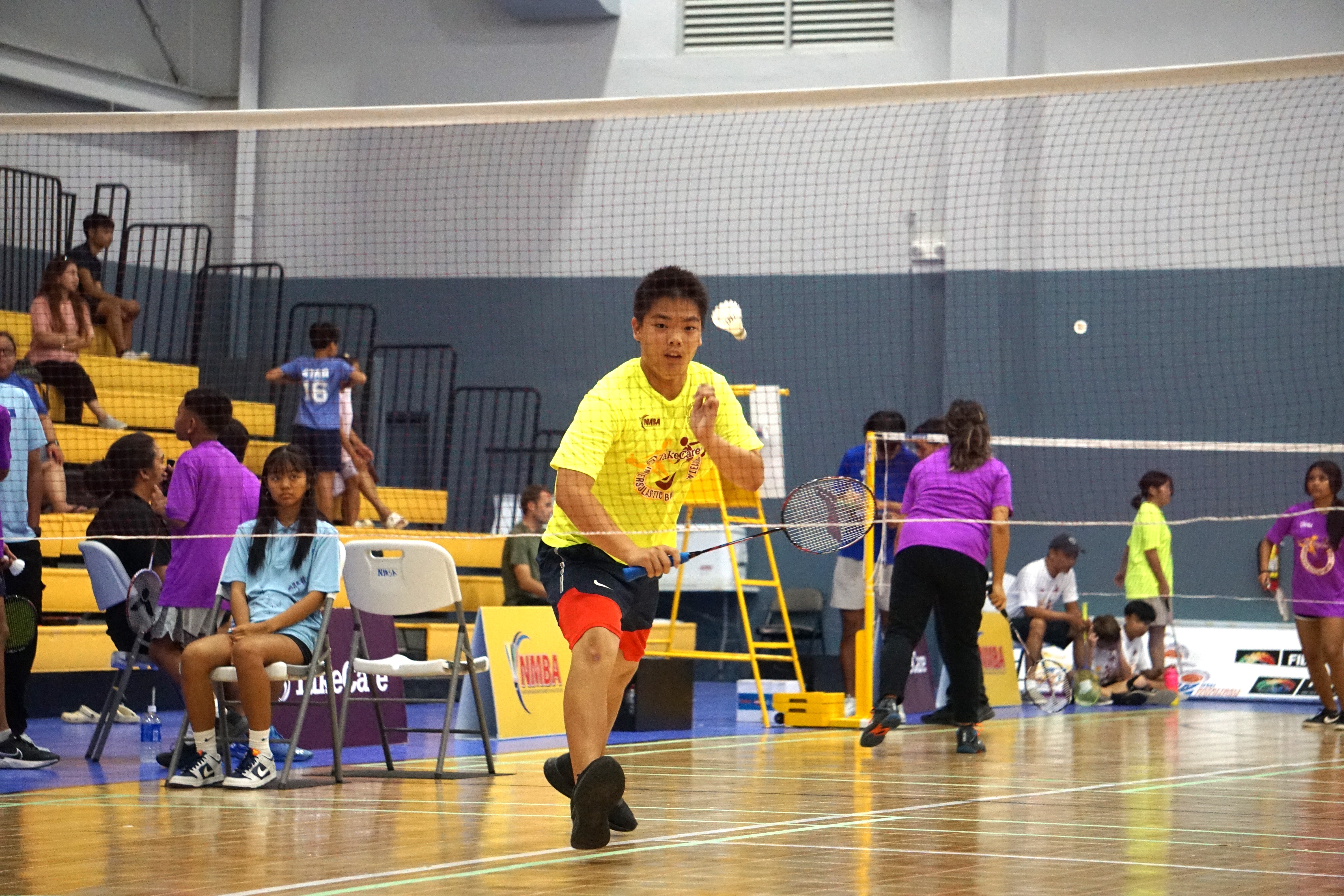 Hopwood Middle School's Yong Jun Lin reaches for the back hand return in the co-ed middle school division’s boys singles event of the TakeCare Interscholastic Badminton League SY23-24 held Saturday at the Ada gym.