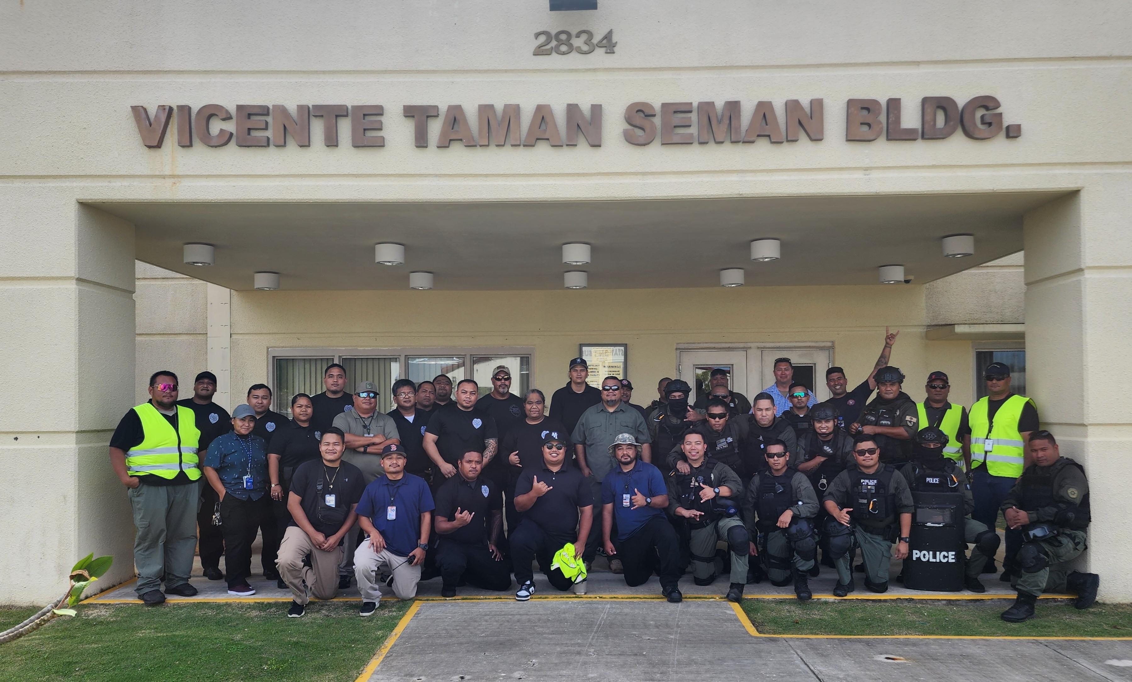 KONFITMA participants pose for a group photo at the Department of Corrections where a simulated "hostage situation" took place Wednesday as part of a training exercise for first responders.
