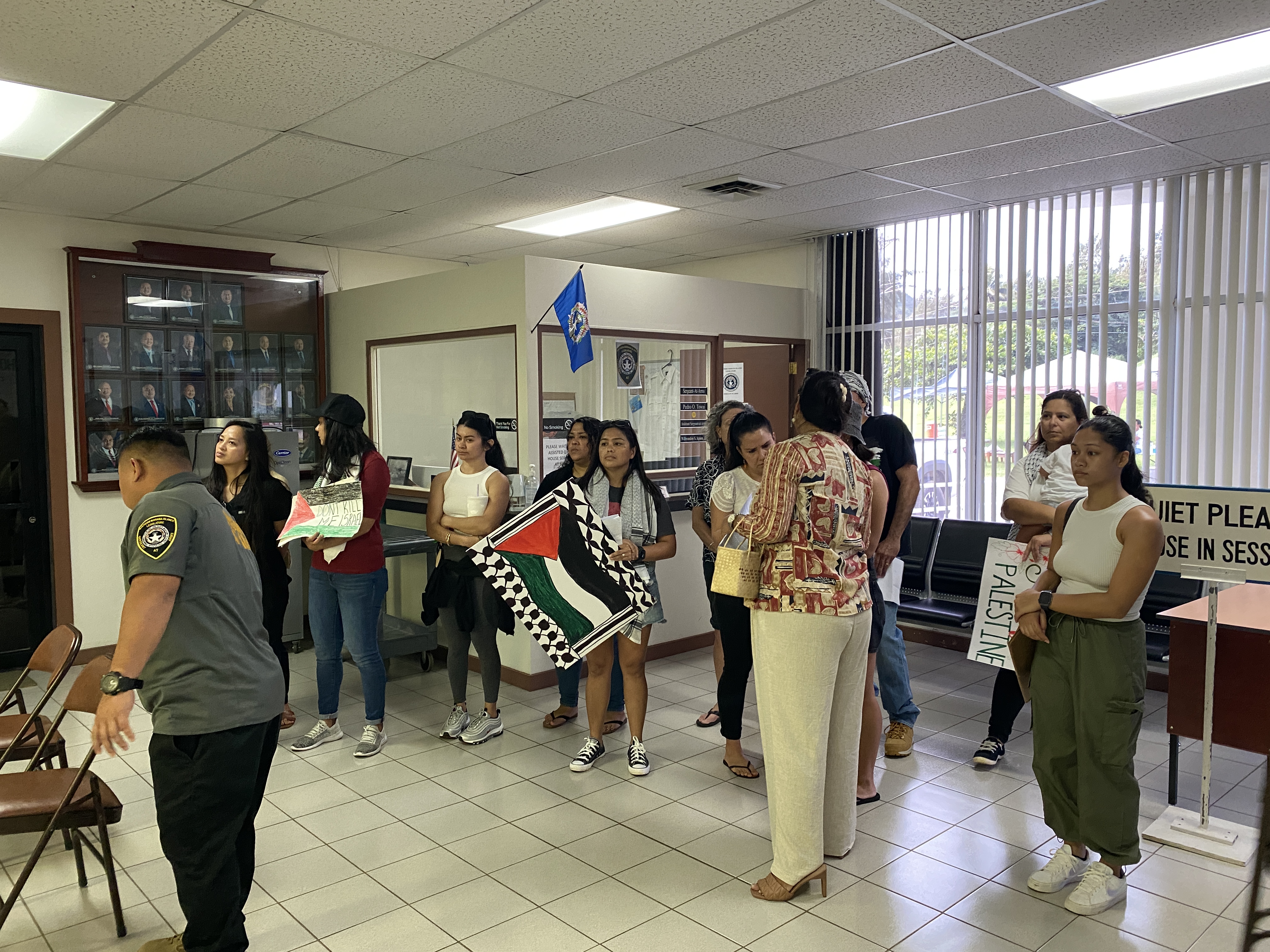 Some of the protestors gather in the lobby outside the House chamber.