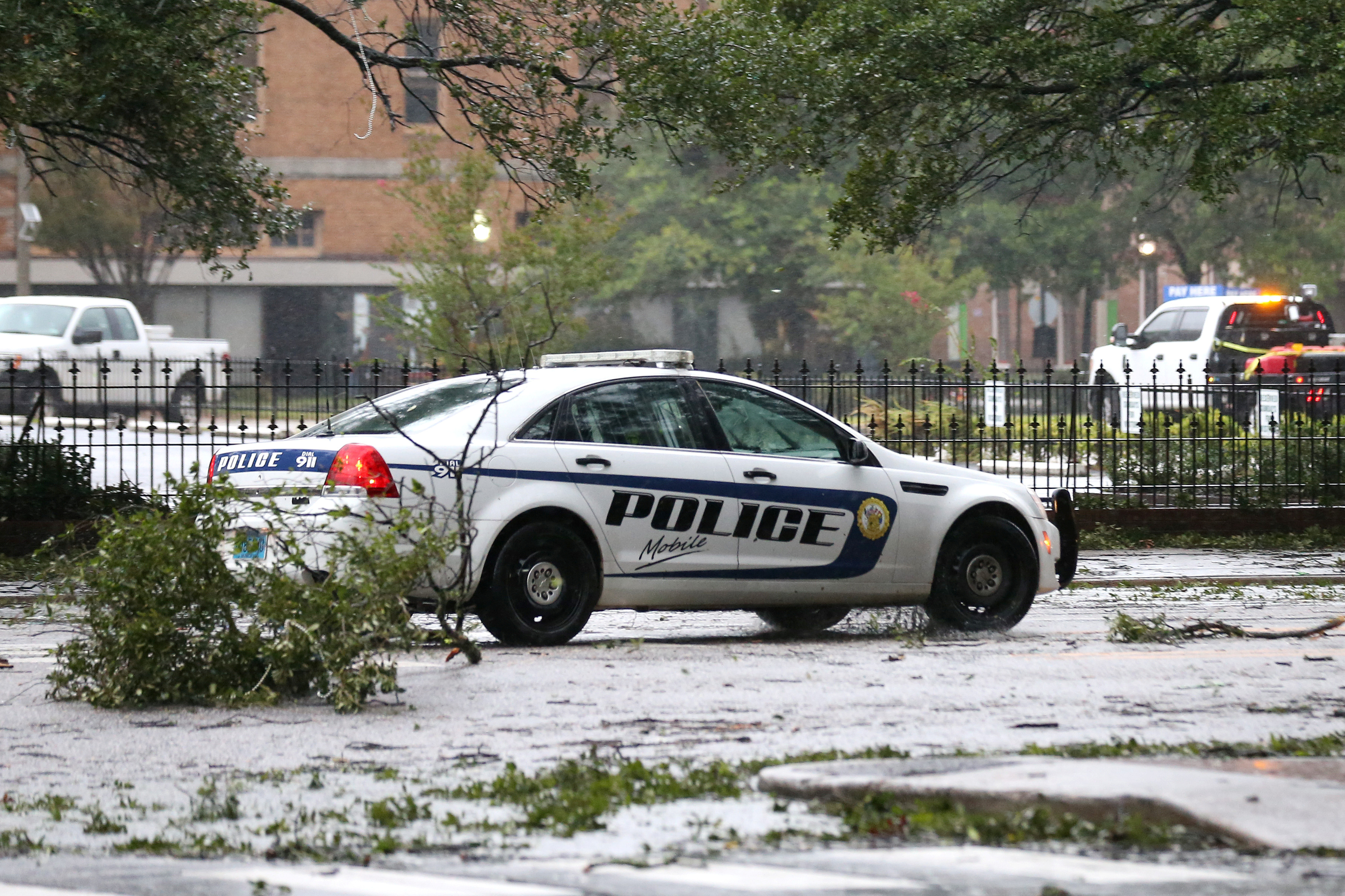 A Mobile Police Department vehicle drives down Government Street during Hurricane Sally in Mobile, Alabama, U.S., September 16, 2020. 