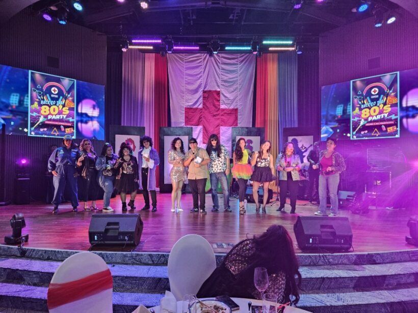 Santi "Big Boy” Sablan poses with the Best 80's dress contestants.