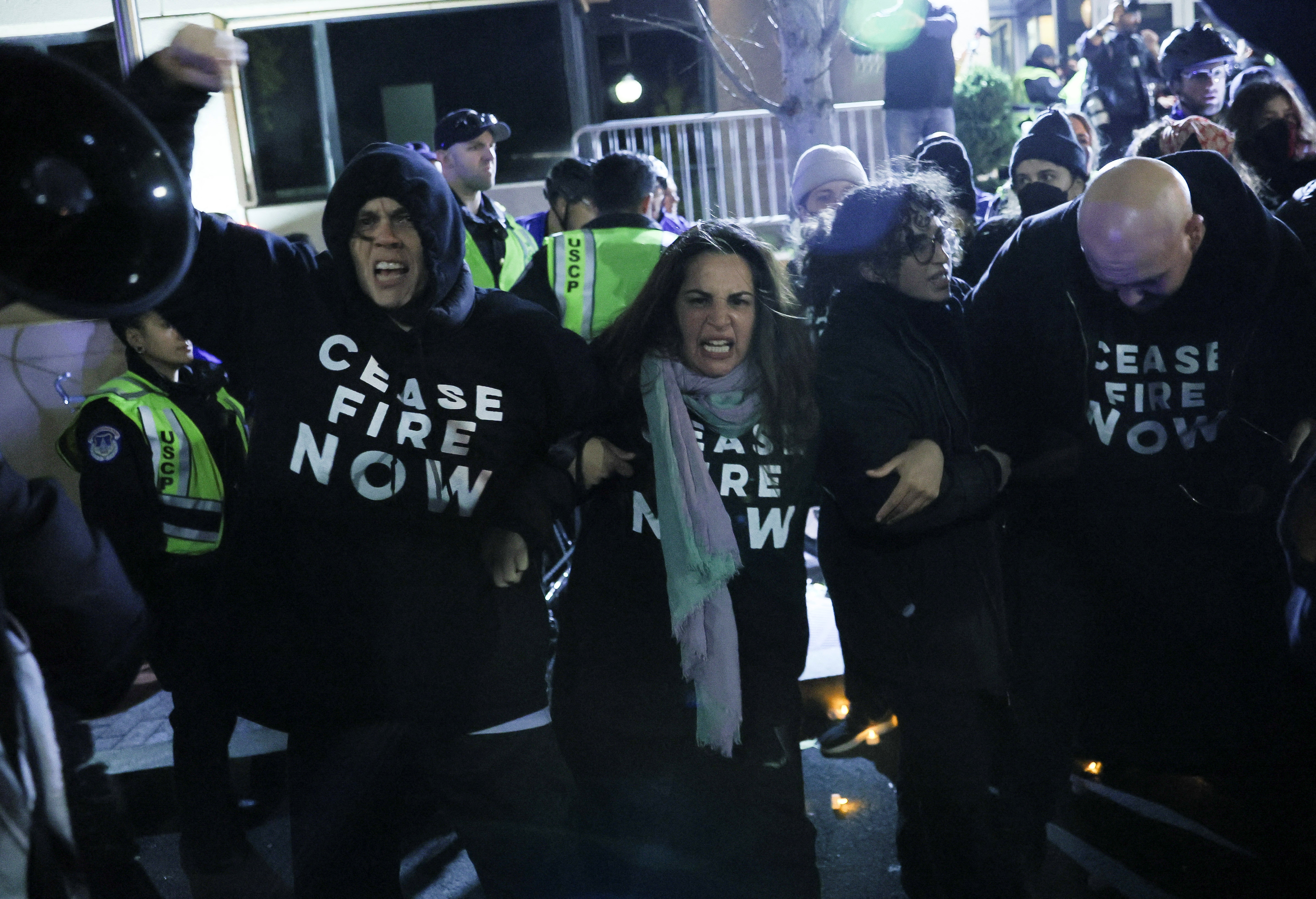 People take part in a march during a multi-denominational event hosted by the Democratic Socialists of America, IfNotNow Movement and Jewish Voice for Peace calling for a ceasefire in the conflict between Israel and Palestinian Islamist group Hamas, in Washington, U.S. November 15, 2023. 