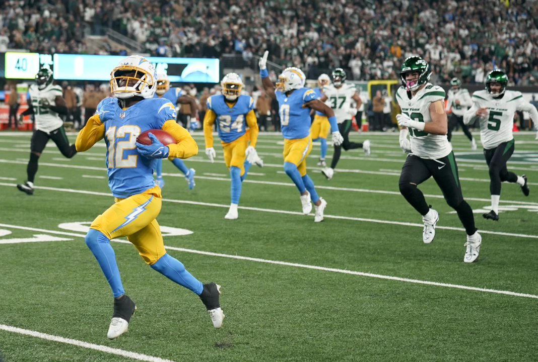 Los Angeles Chargers wide receiver Derius Davis runs back a punt return for a touchdown against the New York Jets during the first quarter of an NFL game, Monday, Nov. 6. 2023 in East Rutherford, N.J.