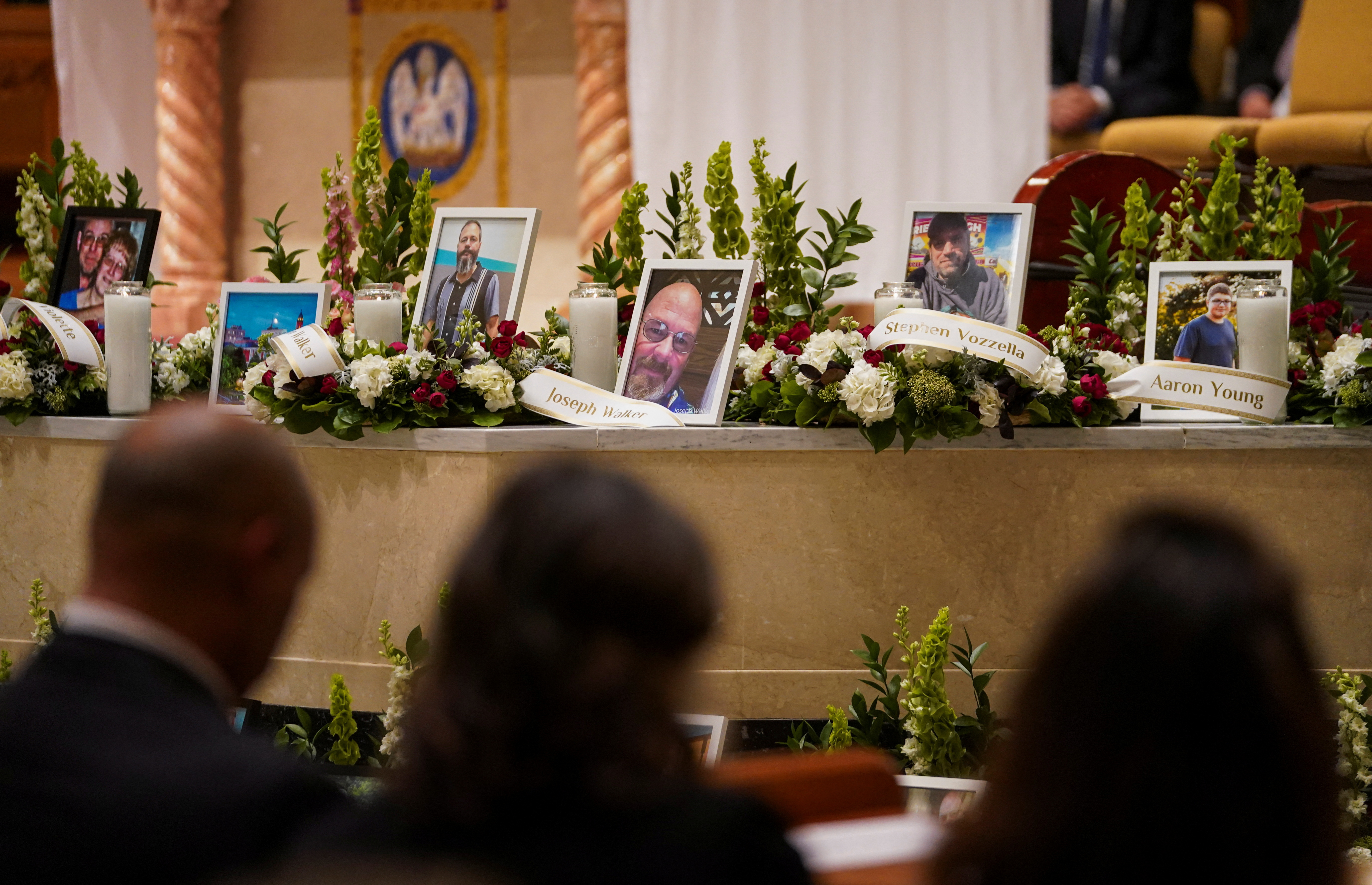 A view shows the pictures of the victims of the deadly mass shooting on the altar as mourners take part in a vigil, in Lewiston, Maine, U.S., October 29, 2023. 