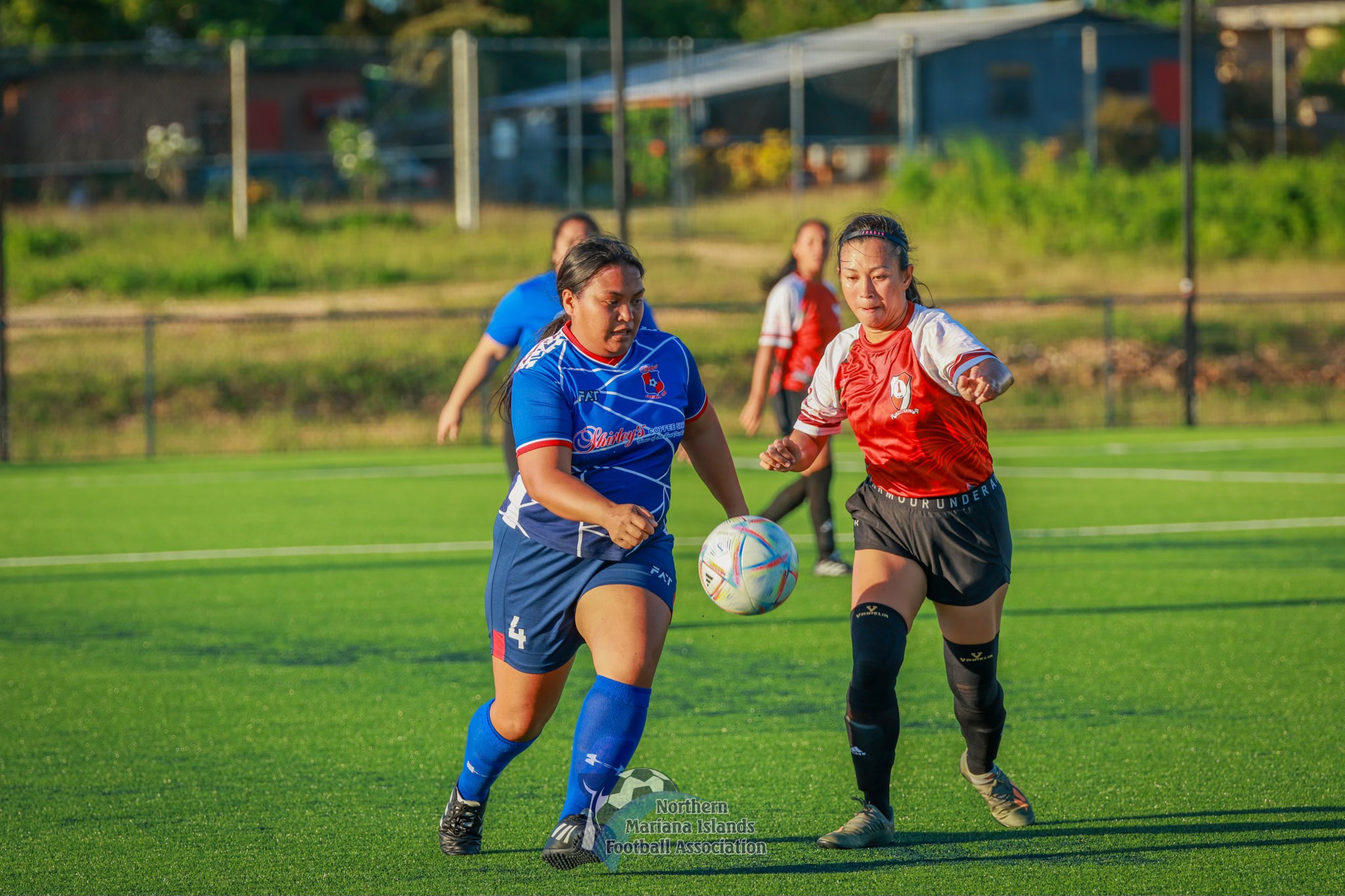 Paire 1's Kathy Ruszala and Shirley's Marilou Arriola chase after the ball during an intermediate division game of the Dove Women's League Fall 2023 at the NMI Soccer Training Center in Koblerville on Sunday.