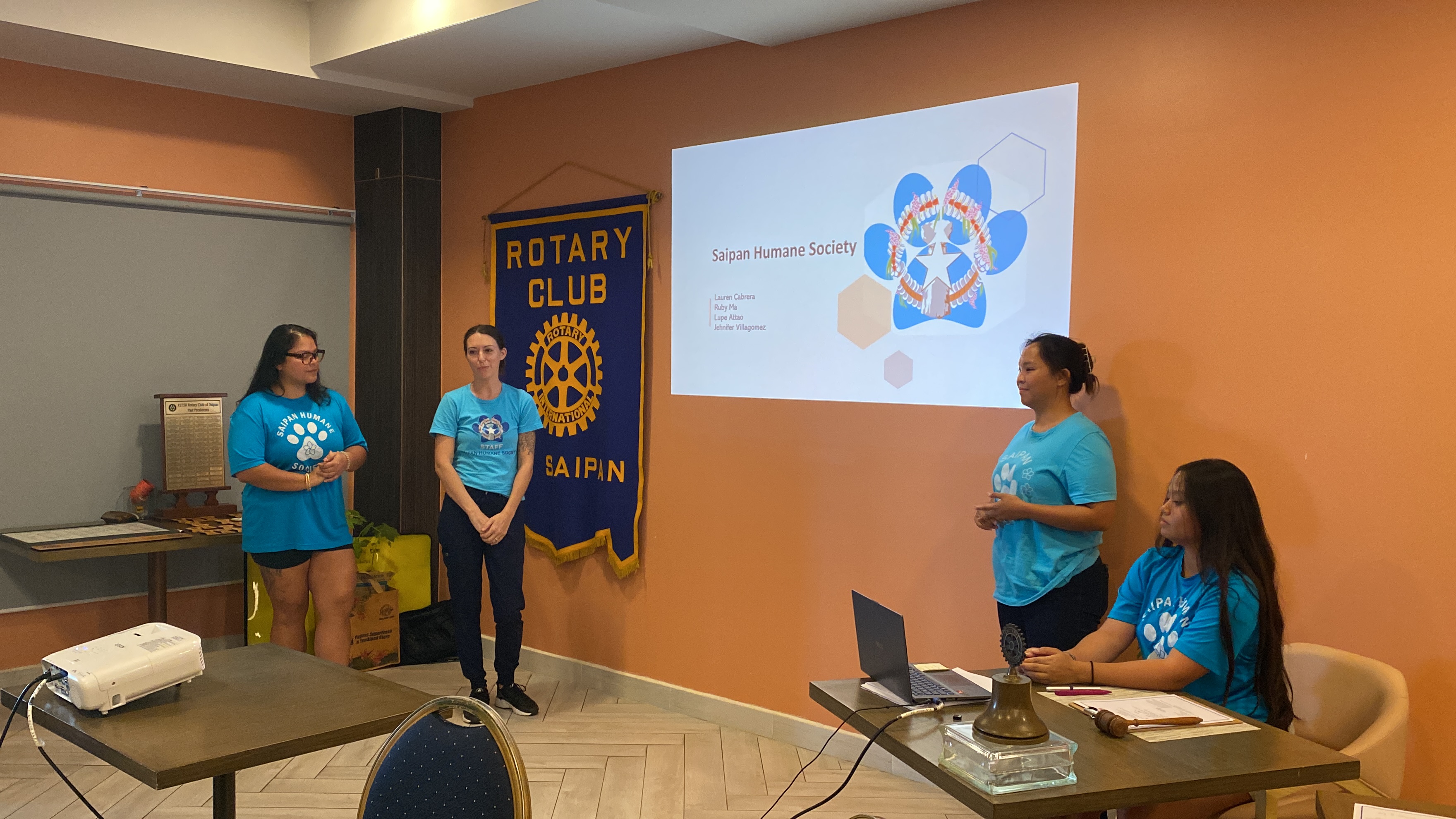 Saipan Humane Society Executive Director Lauren Cabrera, second left, with staff members at the Saipan Rotary Club meeting on Tuesday at Crowne Plaza Resort.