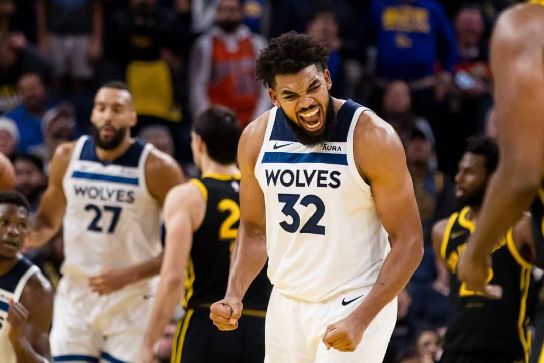 Minnesota Timberwolves forward Karl-Anthony Towns (32) reacts after hitting a three-point shot against the Golden State Warriors during the last minute of the second half at Chase Center in San Francisco, California, Nov. 14, 2023.